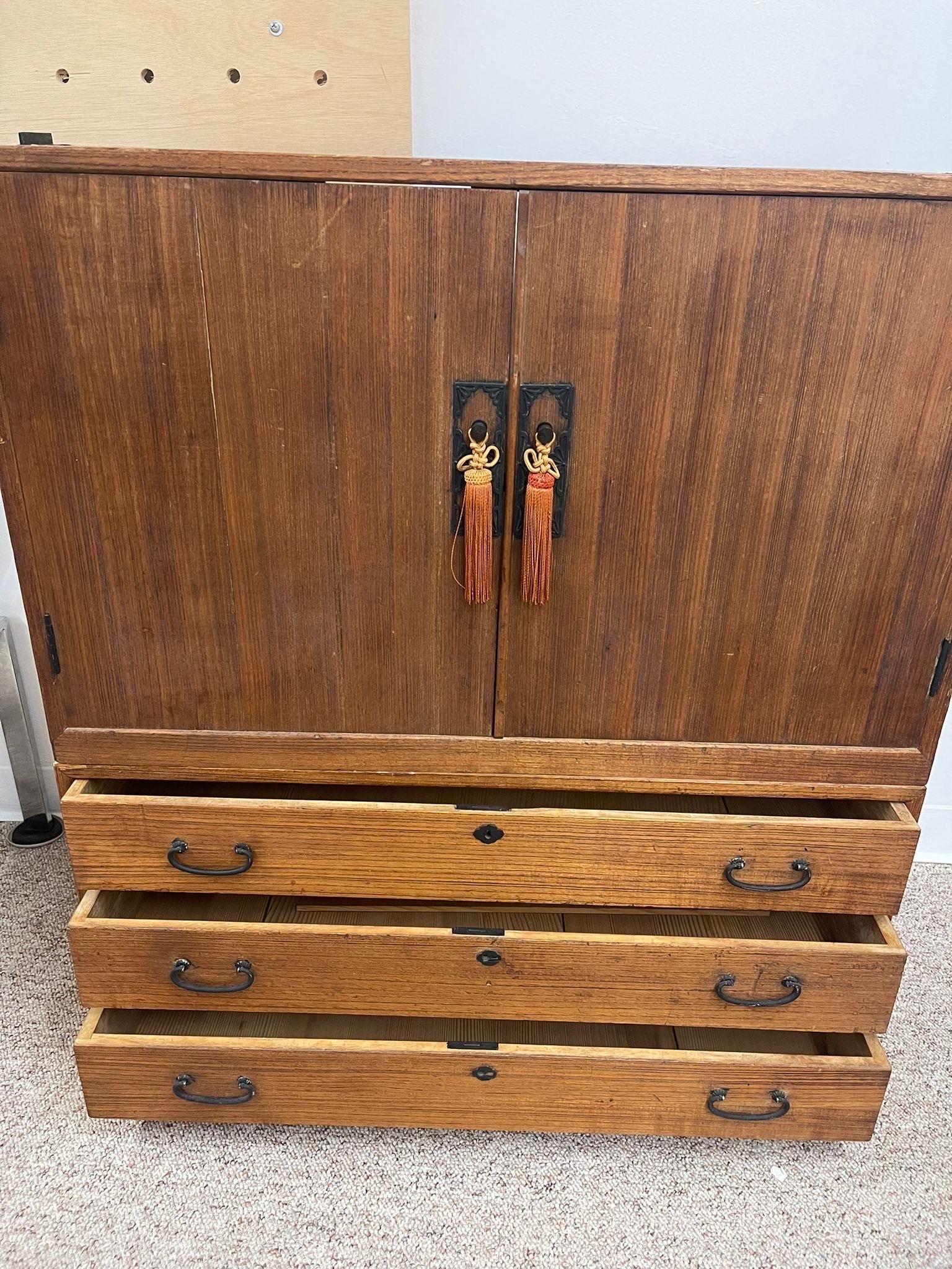 Mid-Century Modern Vintage Tansu Cabinet With Cabinet on Top and Bottom 3 Drawers.