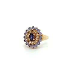 Anello vintage in oro con tanzanite e diamanti, con montatura a grappolo e halo – Gioielli di pregio di seconda mano