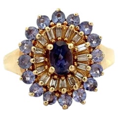Anello vintage in oro con tanzanite e diamanti, con montatura a grappolo e halo – Gioielli di pregio di seconda mano
