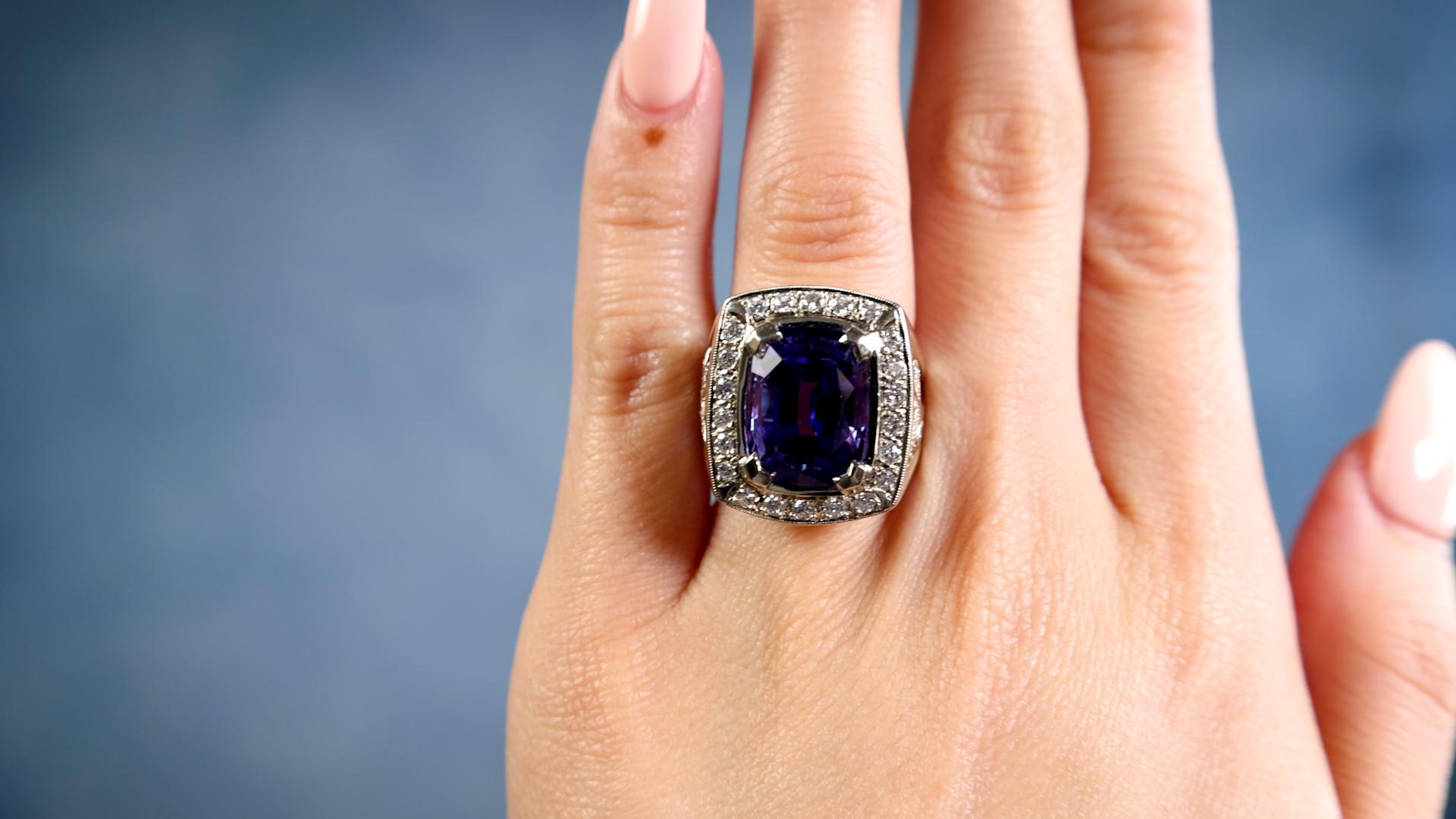 One Vintage Tanzanite Diamond 14k White Gold Ring. Featuring one cushion mixed cut tanzanite weighing approximately 8.50 carats. Accented by 32 round brilliant cut diamonds with a total weight of approximately 1.15 carats, graded F-G color, VS