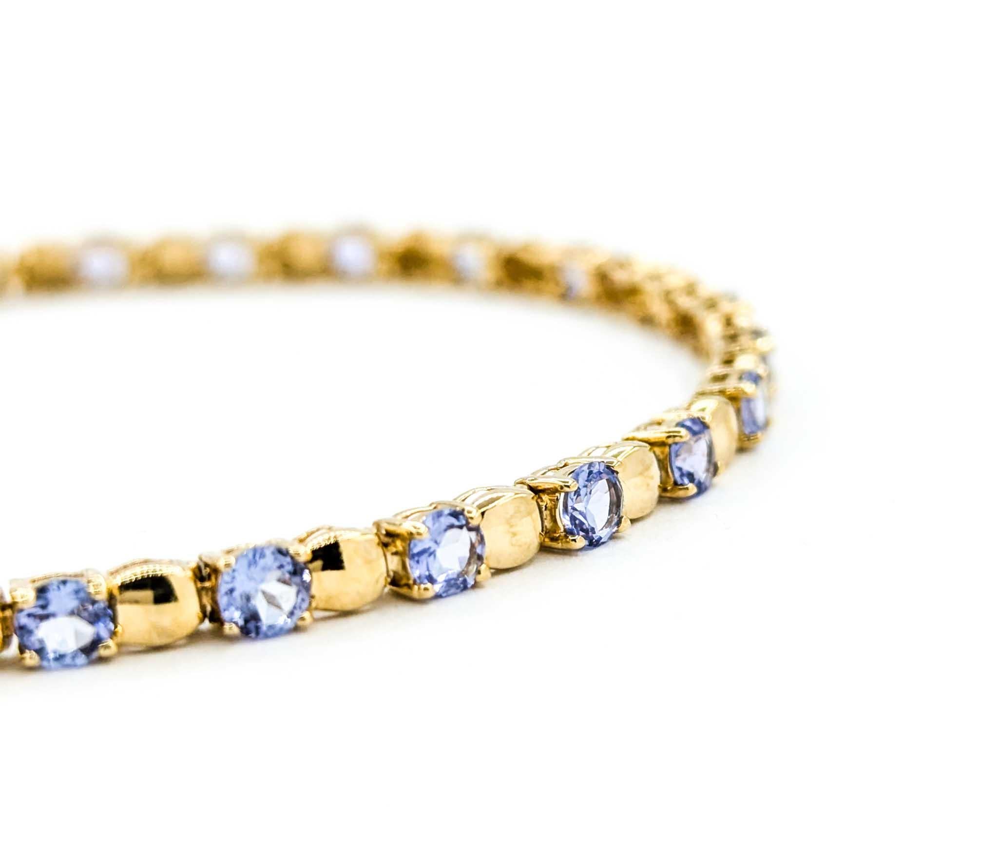 Vintage Tanzanite Line Bracelet in Yellow Gold In Excellent Condition In Bloomington, MN