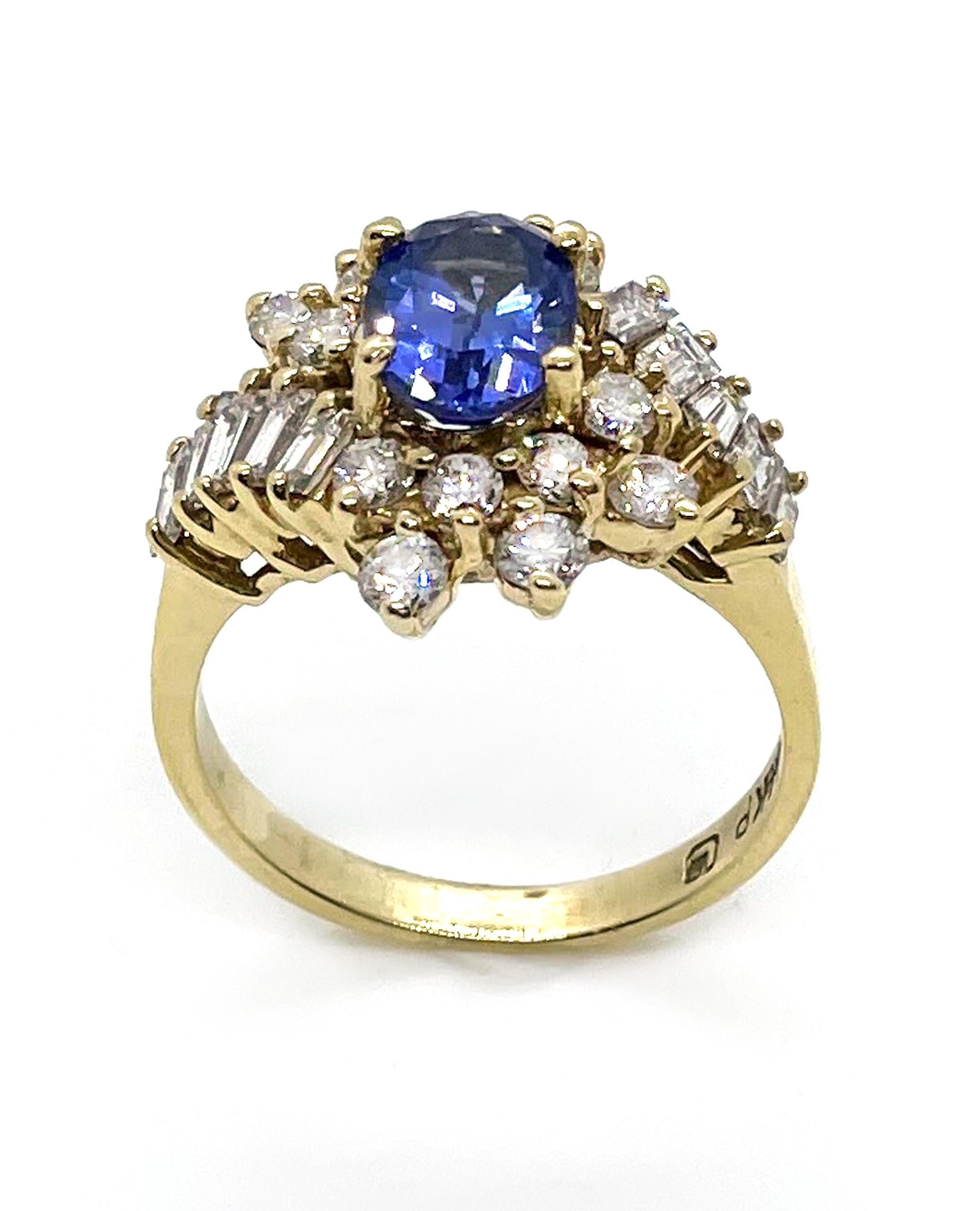 Vintage 14K yellow gold ring with one oval tanzanite 1.15 carats.  14 round diamonds and 10 baguette diamonds totaling 1.22 carats. (G/H color, VS clarity)

-Created circa 1985