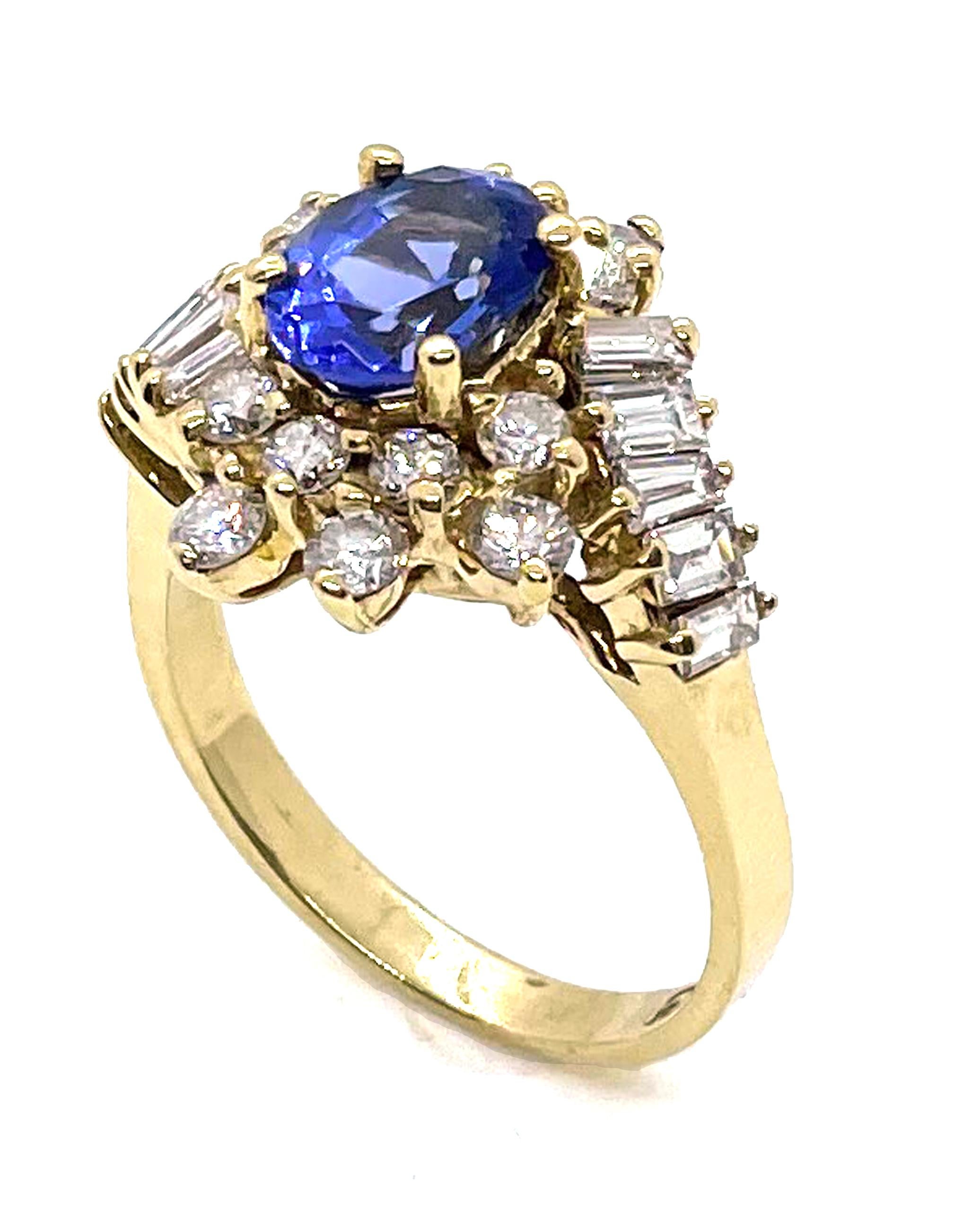 Vintage 14K yellow gold ring with one oval tanzanite 1.15 carats.  14 round diamonds and 10 baguette diamonds totaling 1.22 carats. (G/H color, VS clarity)

-Created circa 1985