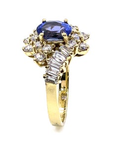 Vintage Oval Tanzanite Ring with Round and Baguette Diamonds Set in 14k Gold