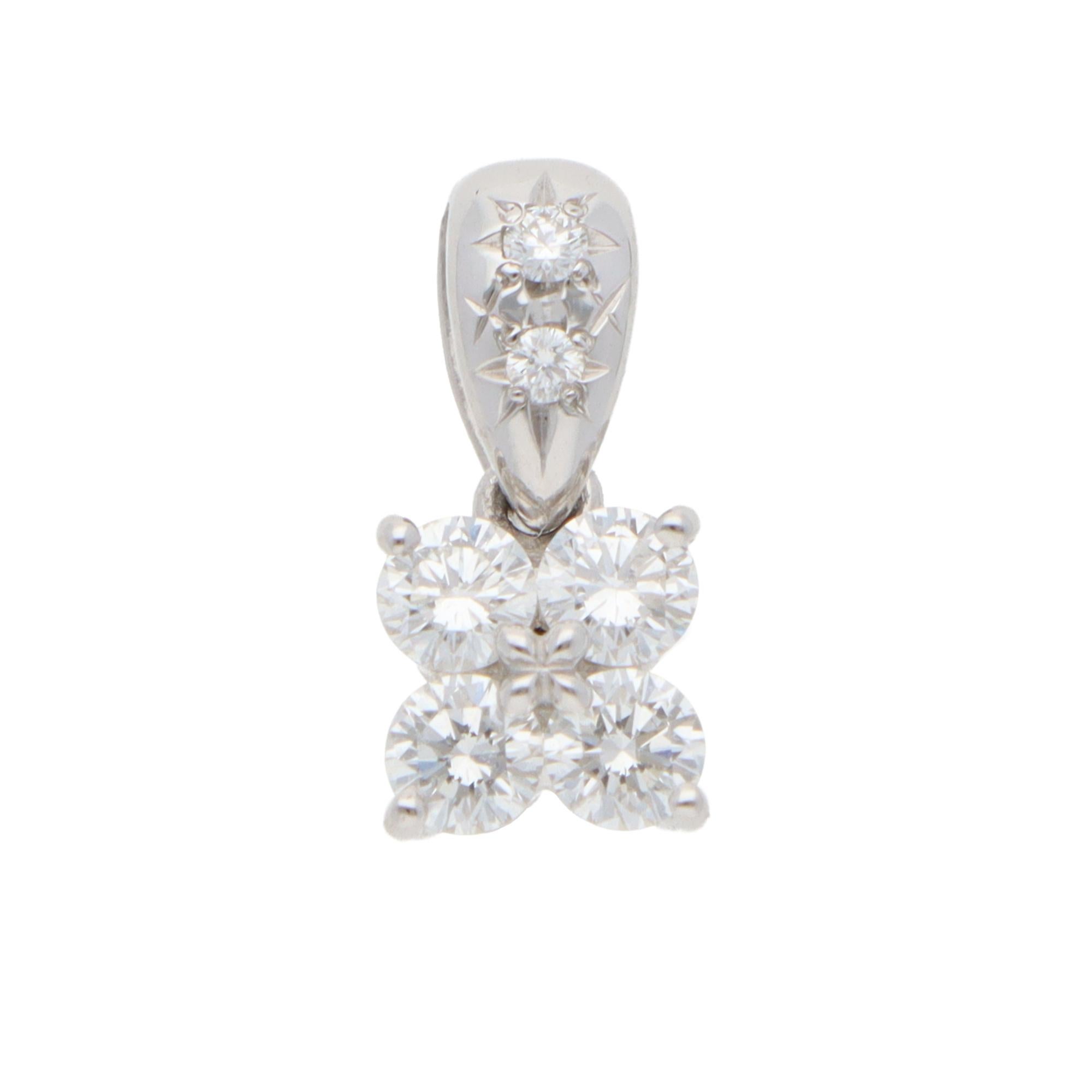 A beautiful vintage Tasaki floral diamond pendant set in platinum.

The pendant depicts a floral motif set with 4 round brilliant-cut diamonds securely four-prong set close to each other. It connects to a polished bail set with 2 smaller diamonds