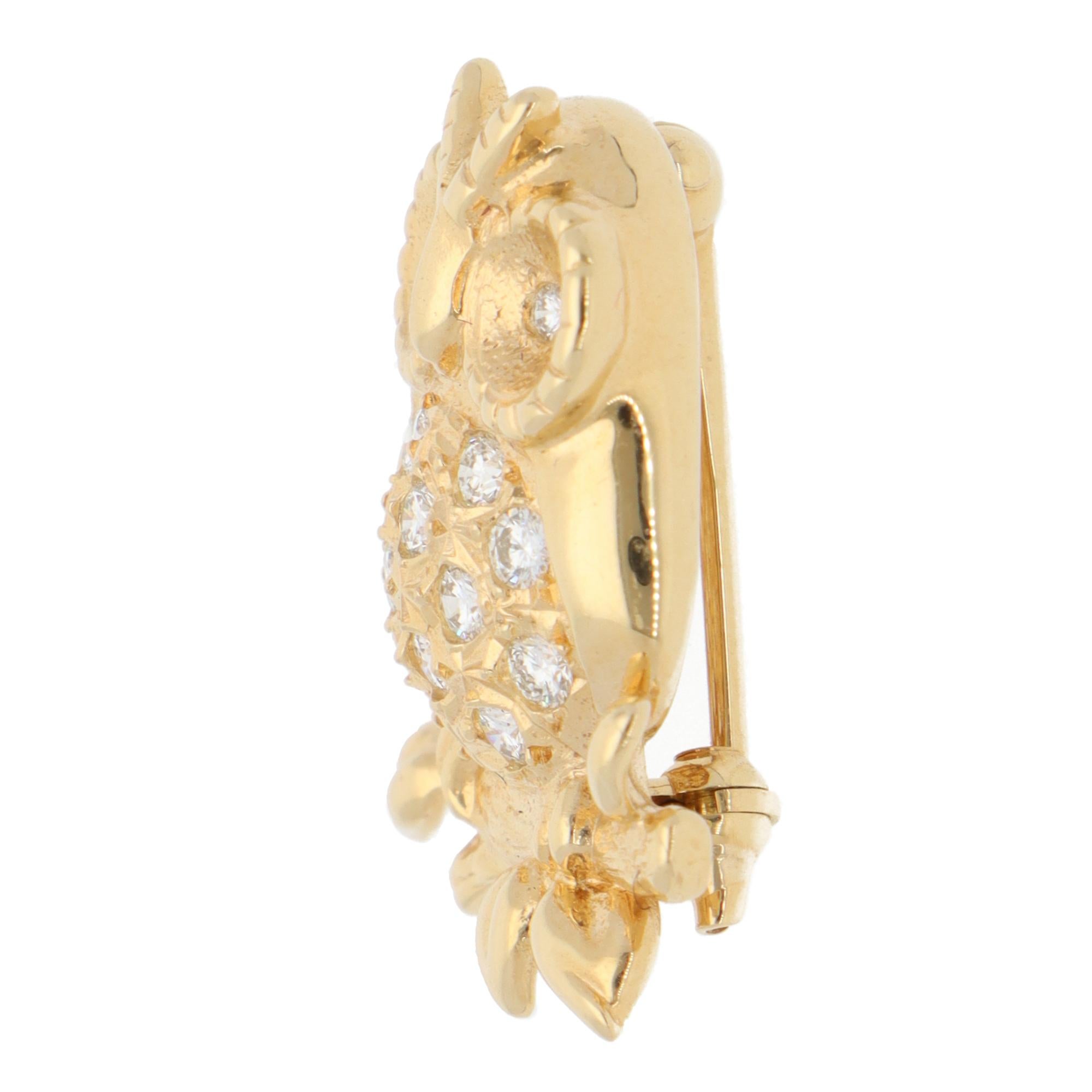An interesting vintage Tasaki diamond owl brooch set in 18k yellow gold.

The brooch depicts a perching owl and has been beautifully hand-crafted to show its naturalistic features. Its eyes and body are pavé set with 14 round brilliant cut diamonds.