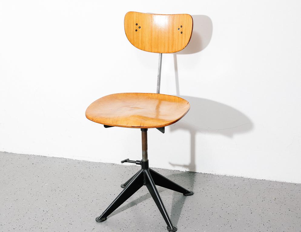 Industrial task stool in the manner of Jean Prouvé. Adjustable height and backrest.