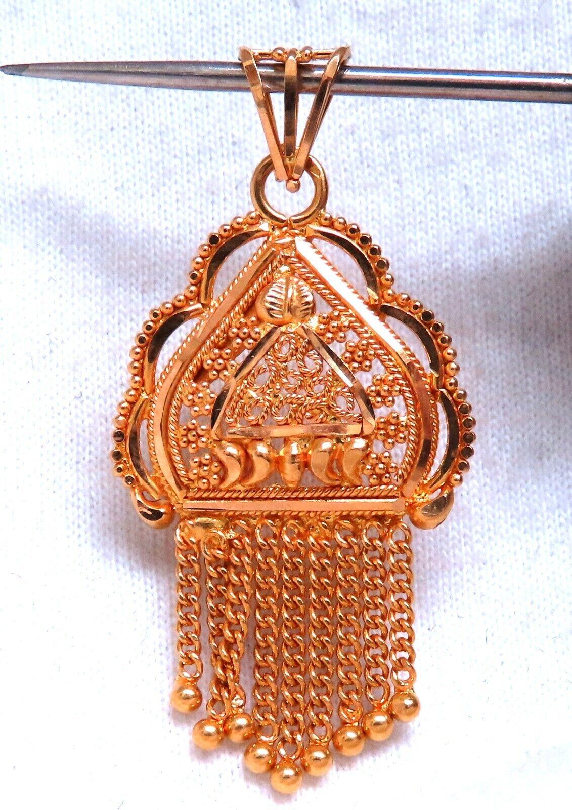 Vintage Gold Charm

22kt. Yellow gold. 4.7 grams.

19 x 38mm

Depth:  2.6mm