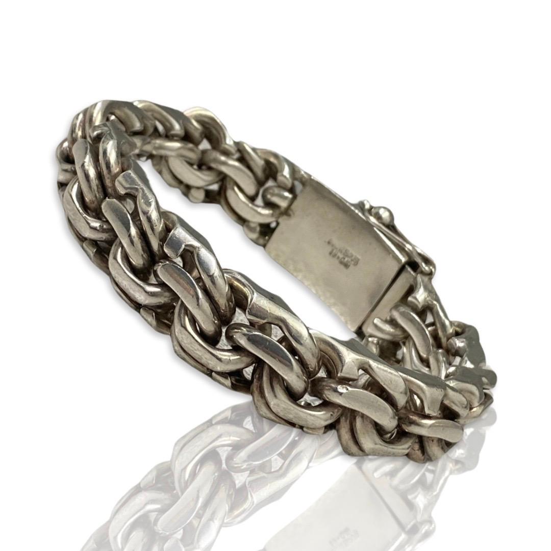 Vintage Men’s Byzantine Style Link Sterling Silver Bracelet. The bracelet is thick and measures 18mm X 12mm in width and measures 9 inches in length. The silver color, material and metal of 925S purity are of high quality and ensure durability. The