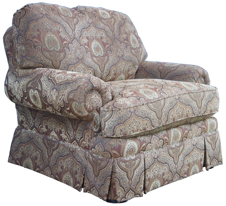 Taylor King oversized armchair featuring rolled arms and paisley brocade upholstery.
   