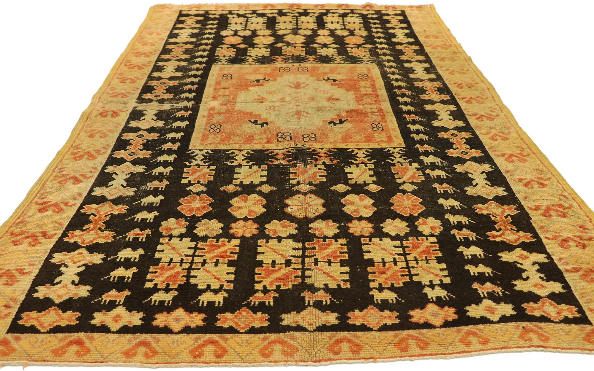 20187 Vintage Taznakht Moroccan Rug, 04'06 x 07'08. Taznakht rugs are a distinctive style of handwoven rug hailing from the Taznakht region nestled in the High Atlas Mountains of Morocco. Renowned for their vivid colors, intricate geometric designs,