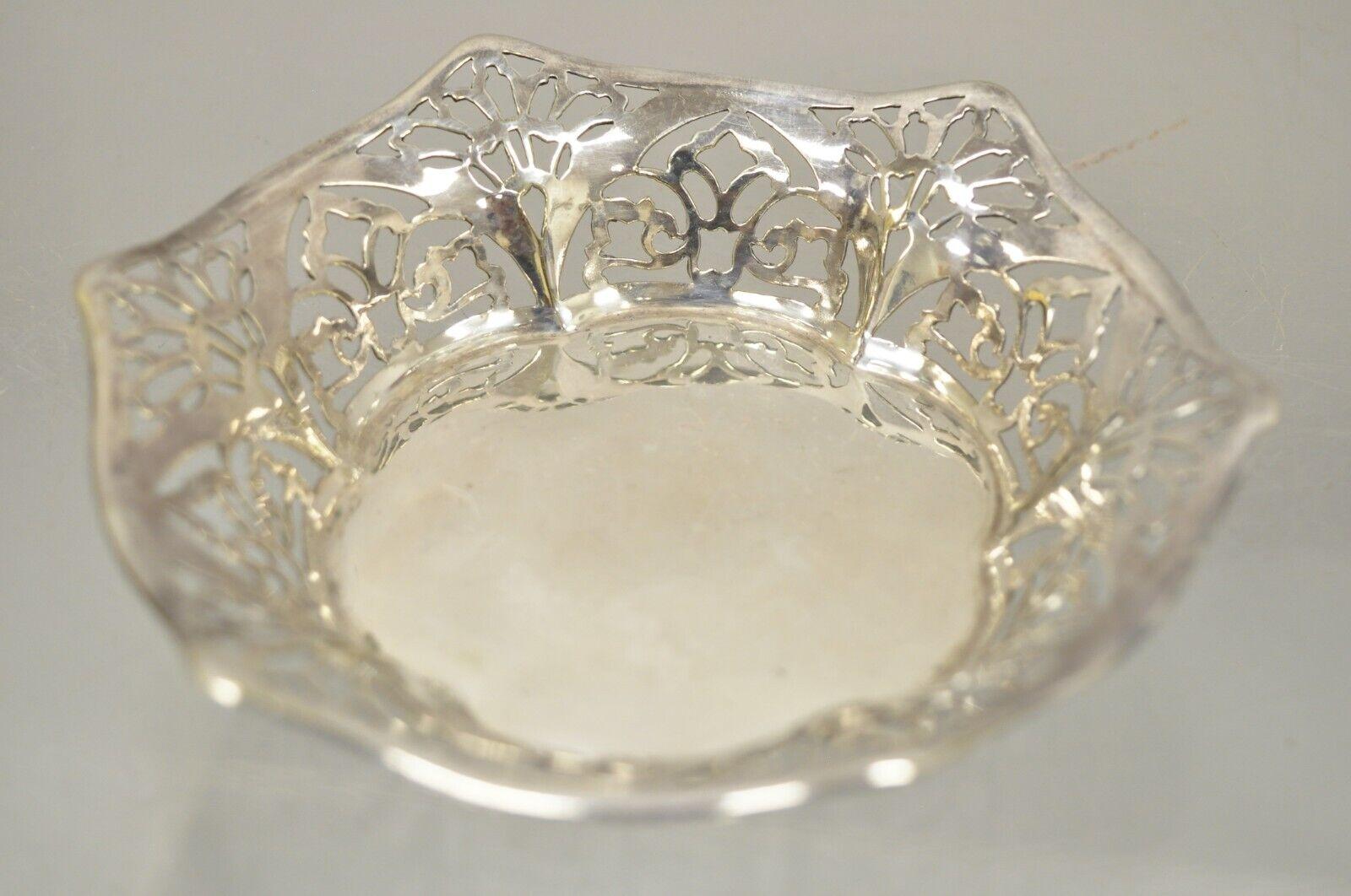 Vintage TBB England silver plate EPNS small floral pierced trinket dish bowl. Item features floral fretwork pierced decoration, nice small size, original stamp early to mid 20th century. Measurements: 1