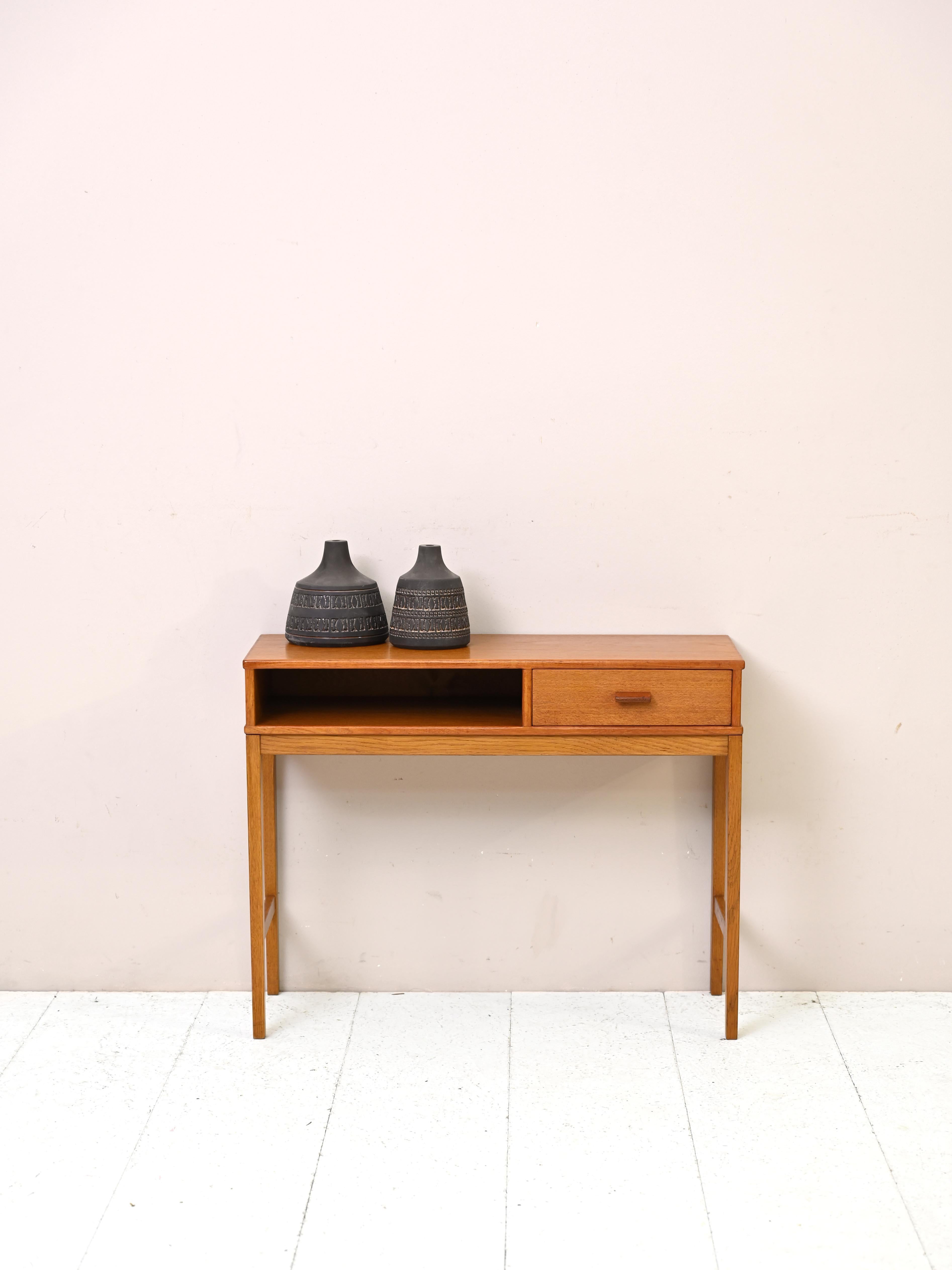 Original 1960s vintage entryway cabinet.

This vintage entryway cabinet combines elegance and practicality with its rectangular wooden frame that includes a small drawer and storage compartment. Ideal for your entryway or for a corner of the home