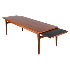 Vintage teak coffee table by Johannes Andersen with two extendible shelves
