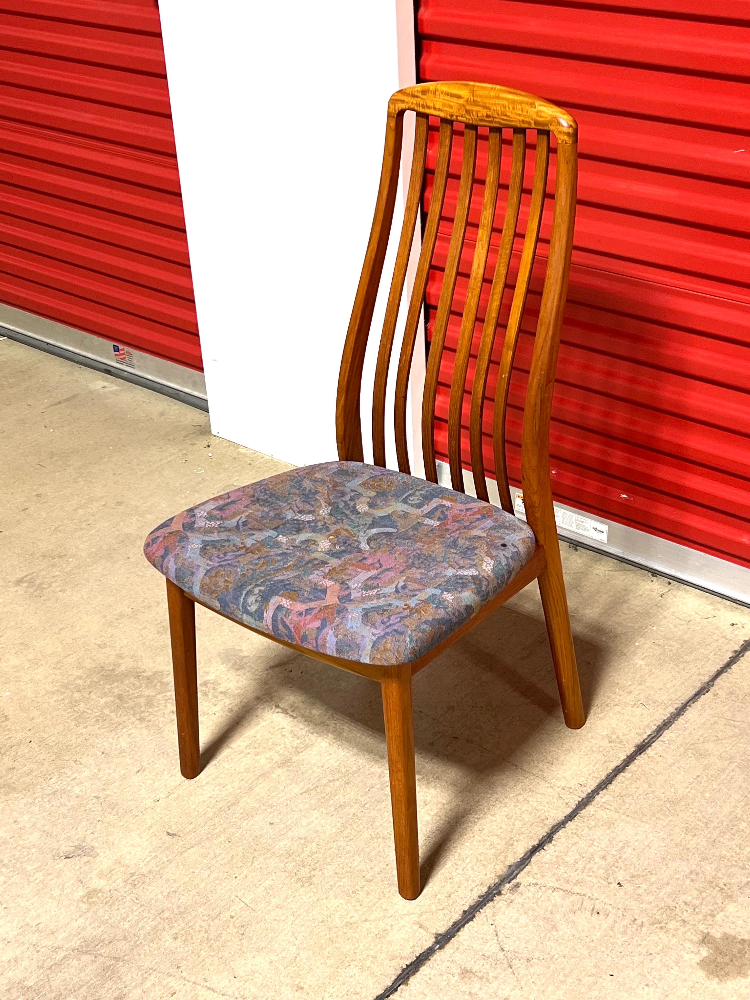 This is a great lot of teak sculptural dining chairs. The set is all original and look fantastic.