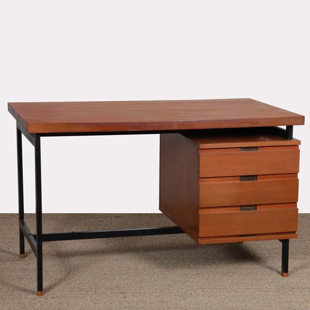 This vintage desk was designed by Pierre Guariche in the 1960s. The structure is in black lacquered metal. The feet are in wood. Cabinet and top are in teak. The table is in original condition and the top has been restored.
