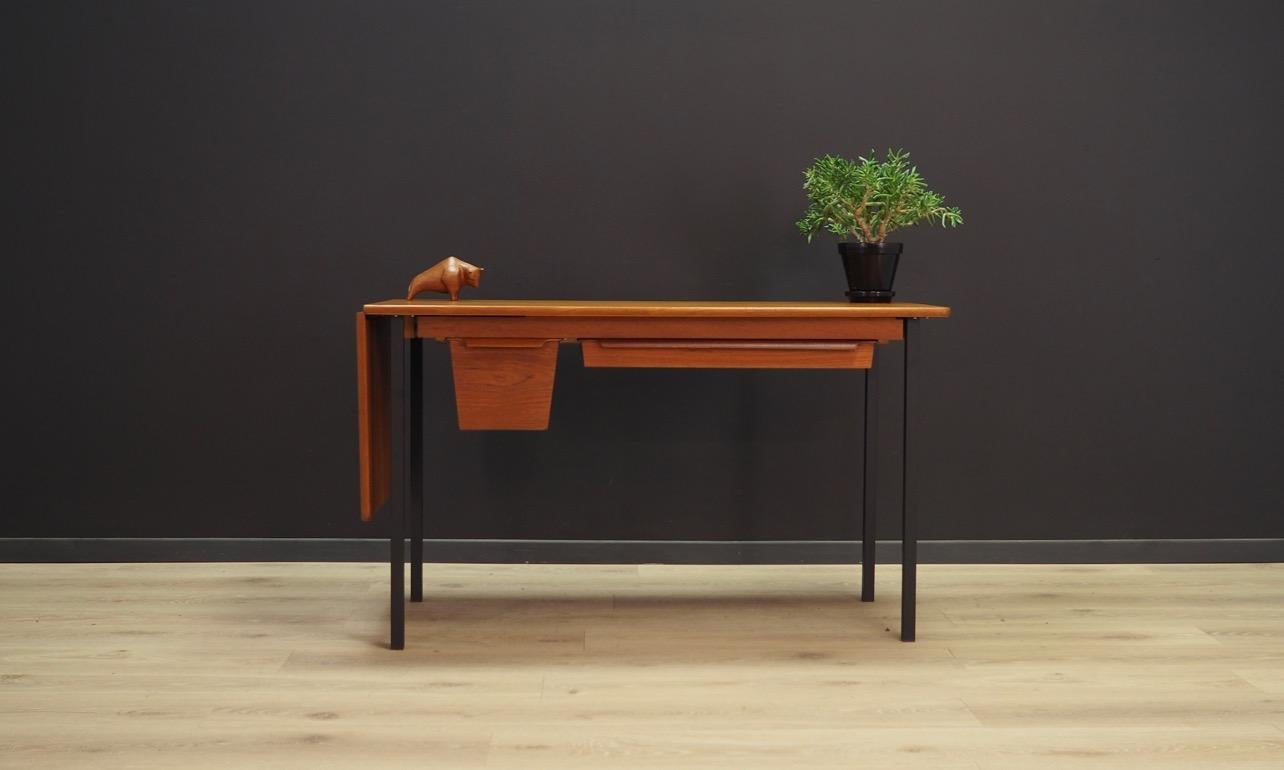 Exceptional desk from the 1960s-1970s, minimalistic design. Desk is veneered with teak. It has one packable draw and one with partitions, on metal legs. Preserved in good condition (minor scratches) - directly for use.

Dimensions: height 68 cm