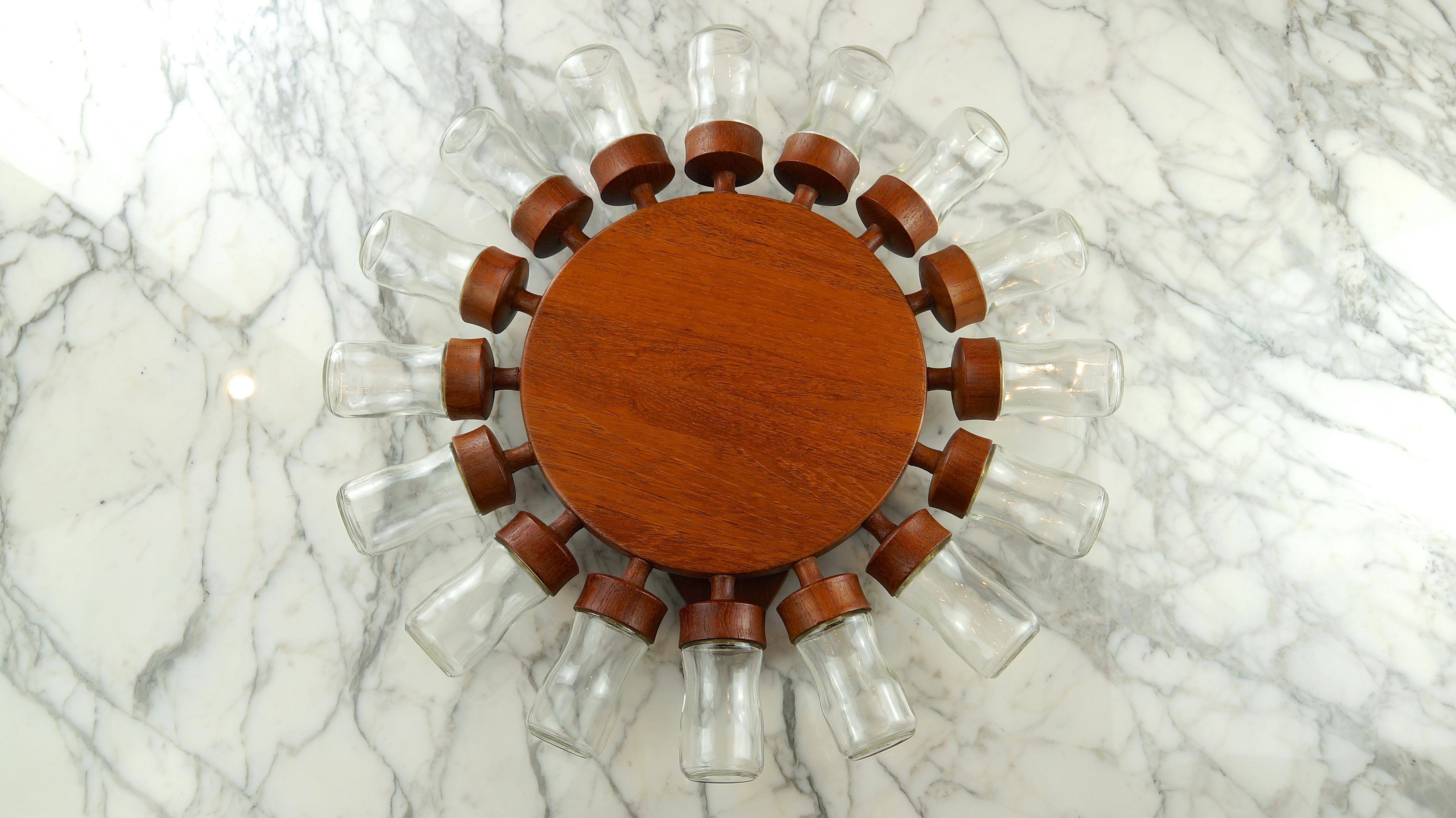 A 16 jar teak Digsmed spinning spice wheel, Denmark, 1960s. This particular piece is rare, not only because it is the largest variant offered, but also because it has the hourglass taper to the arms going out to the jars and on the wooden