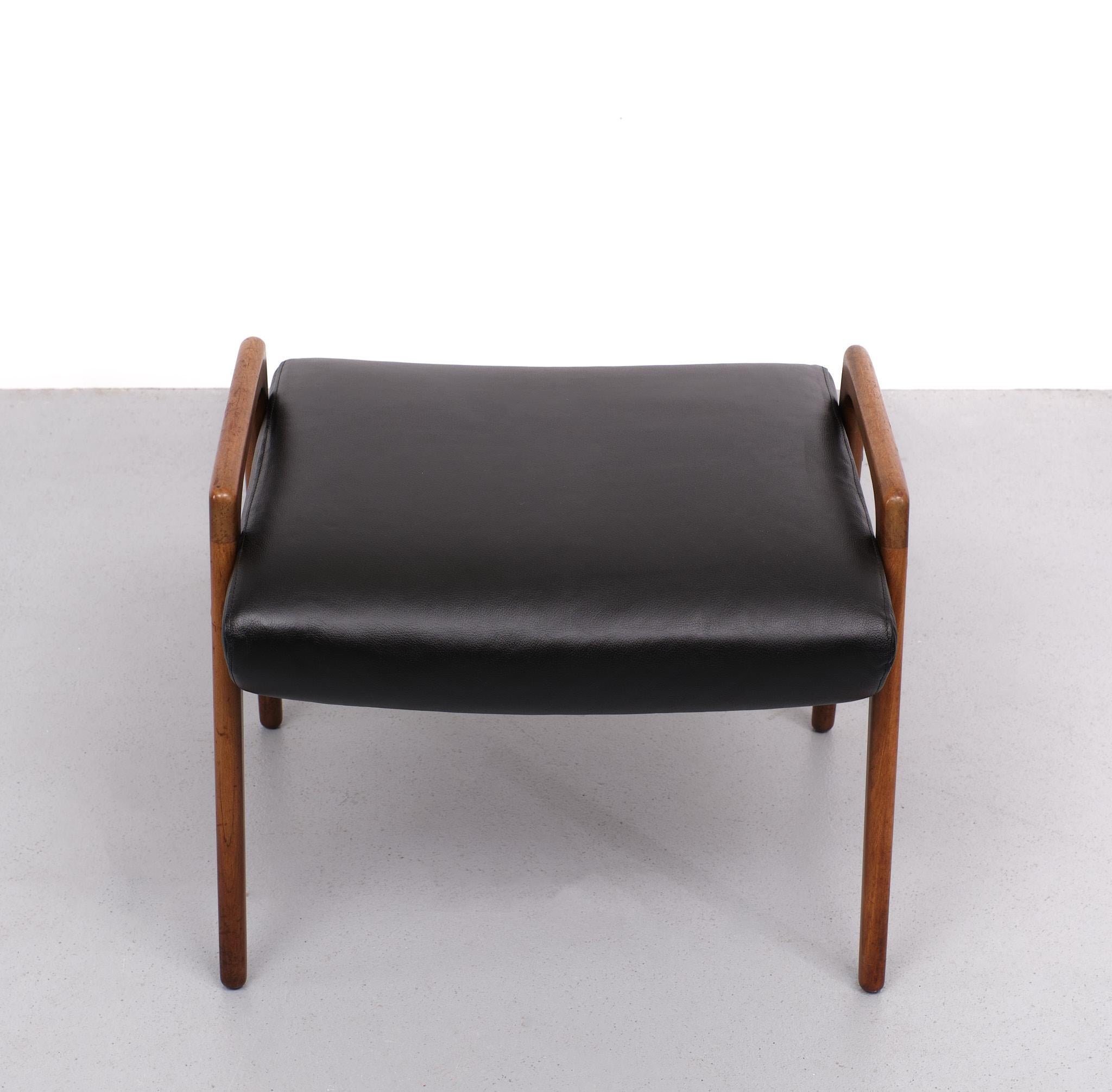 Very nice foot stool or ottoman. Also suitable for seating stool Teak base, comes with a new Faux Leather upholstery. Black color. 1960s Scandinavian. Good condition.