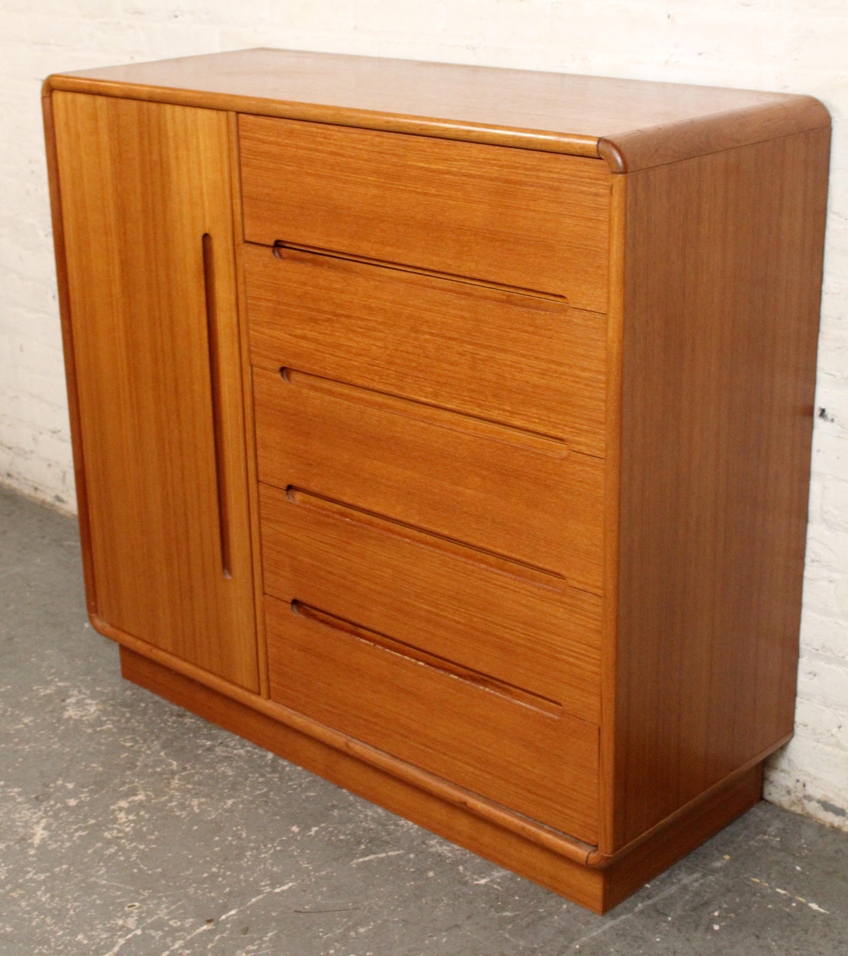 An elegant example of Scandinavian-inspired design, this vintage gentleman’s chest by Sun Cabinet features a warm teak finish and clean, minimalist lines. Comprised of multiple drawers in varying sizes, it offers functional storage while maintaining