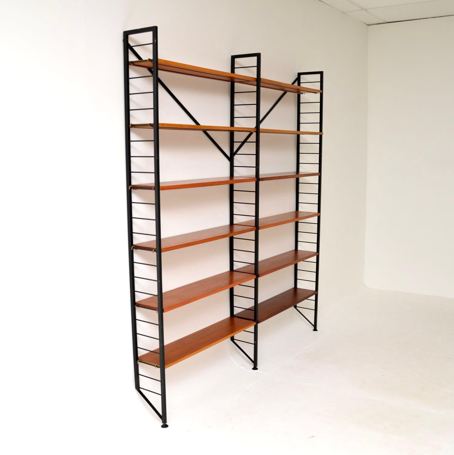 A very stylish and practical vintage teak ladderax bookcase shelving unit. This was made in England, it dates from the 1960’s.

This is a clever and iconic design, the ladderax units were made by Staples and were designed to be extremely flexible,