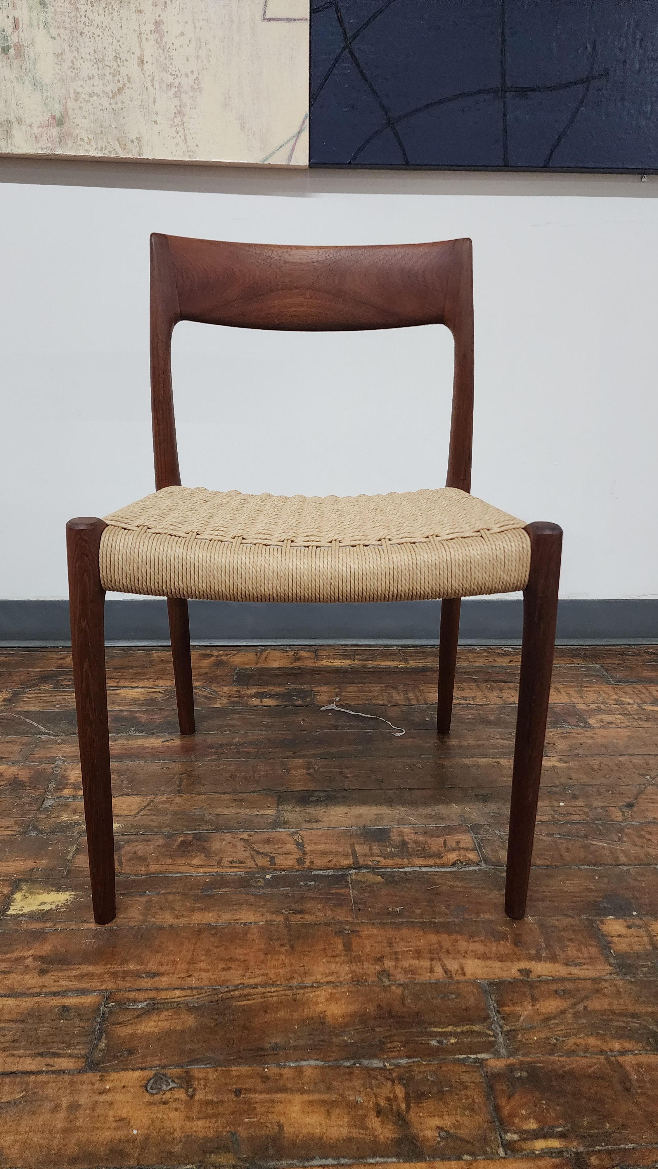 Beautiful refinished teak side chair, model 77 by Niels.moller for J.L. Mollers mobelfabrik.  This chair has been refinished and has new danish paper cord. there are 5 available.  additional model 57 arm chairnis available to make a set of 6.