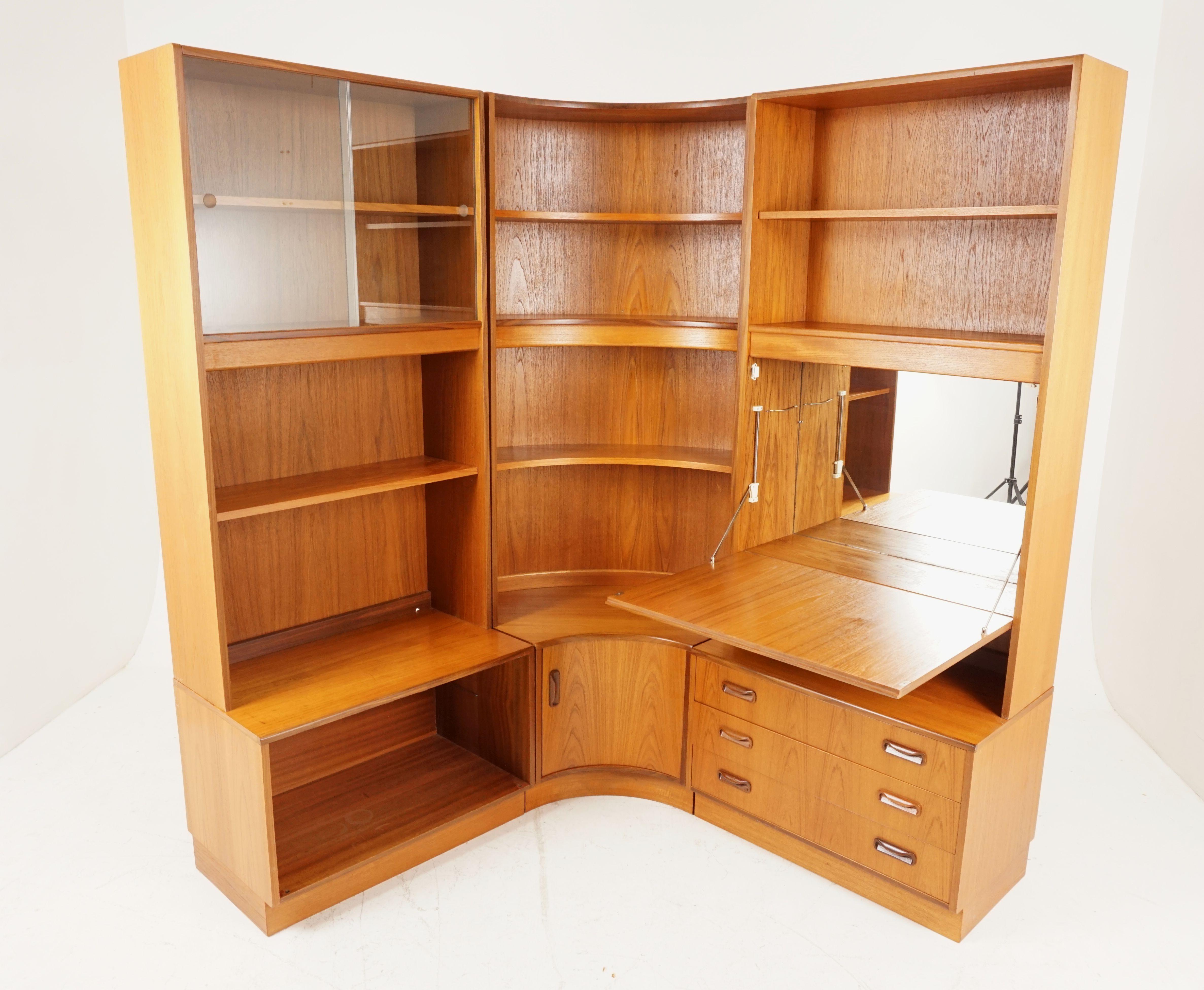 Vintage teak modular 6-piece bookcase, bar, Hutch, G-Plan 1977, B2168

Rounded open corner unit with 3 shelves above with inverted cupboard door below
Cabinet with pair of sliding glass doors and fixed shelf above open cabinet, standing on open