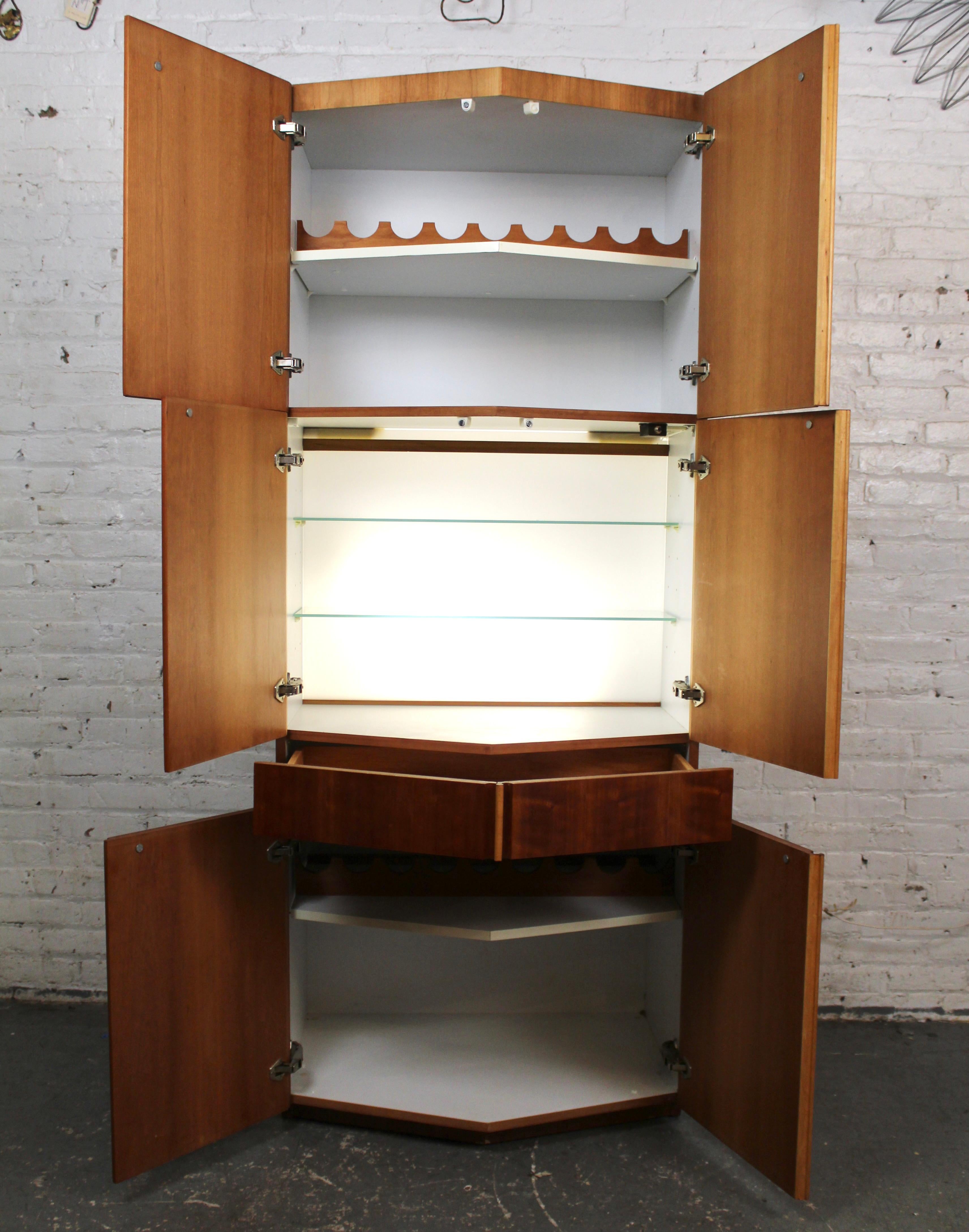 A rare and striking vintage modern wine cabinet by Dillingham, crafted in rich teak with a distinctive pentagonal form. This sculptural piece features clean lines, thoughtful storage for bottles and glassware, and the timeless elegance associated