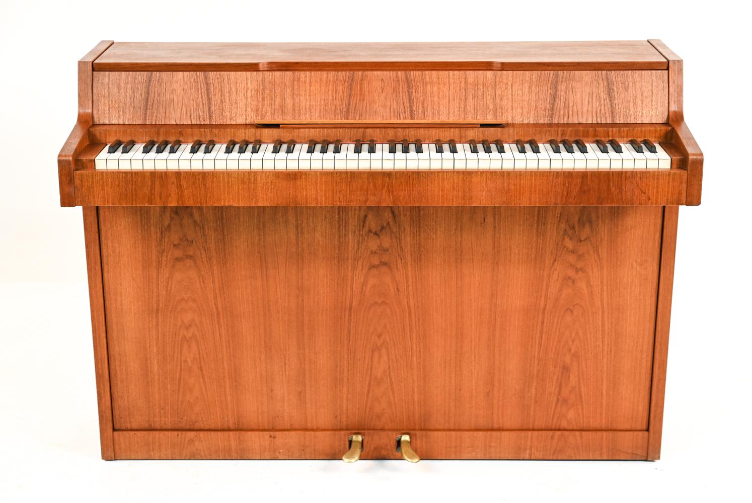 A rare mid-century Danish piano, made of beautiful teak. It is called a pianette because of its 82 keys rather than the standard 88 keys of a full-size piano. This piano is made by the famous piano maker Louis Zwicki. Every piano by Louis Zwicki is