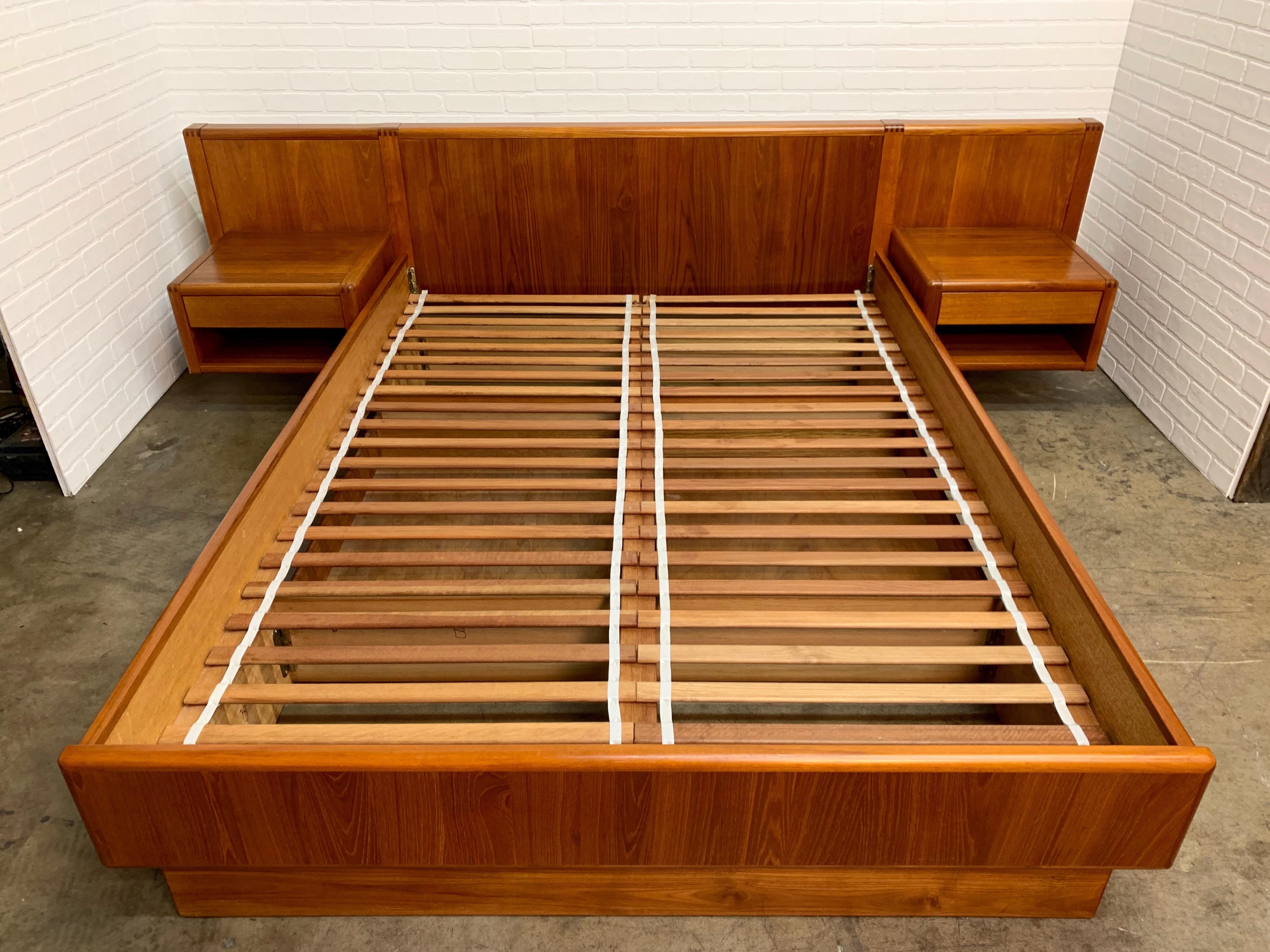 Teak platform queen size bed with floating night stands in the Danish modern style.