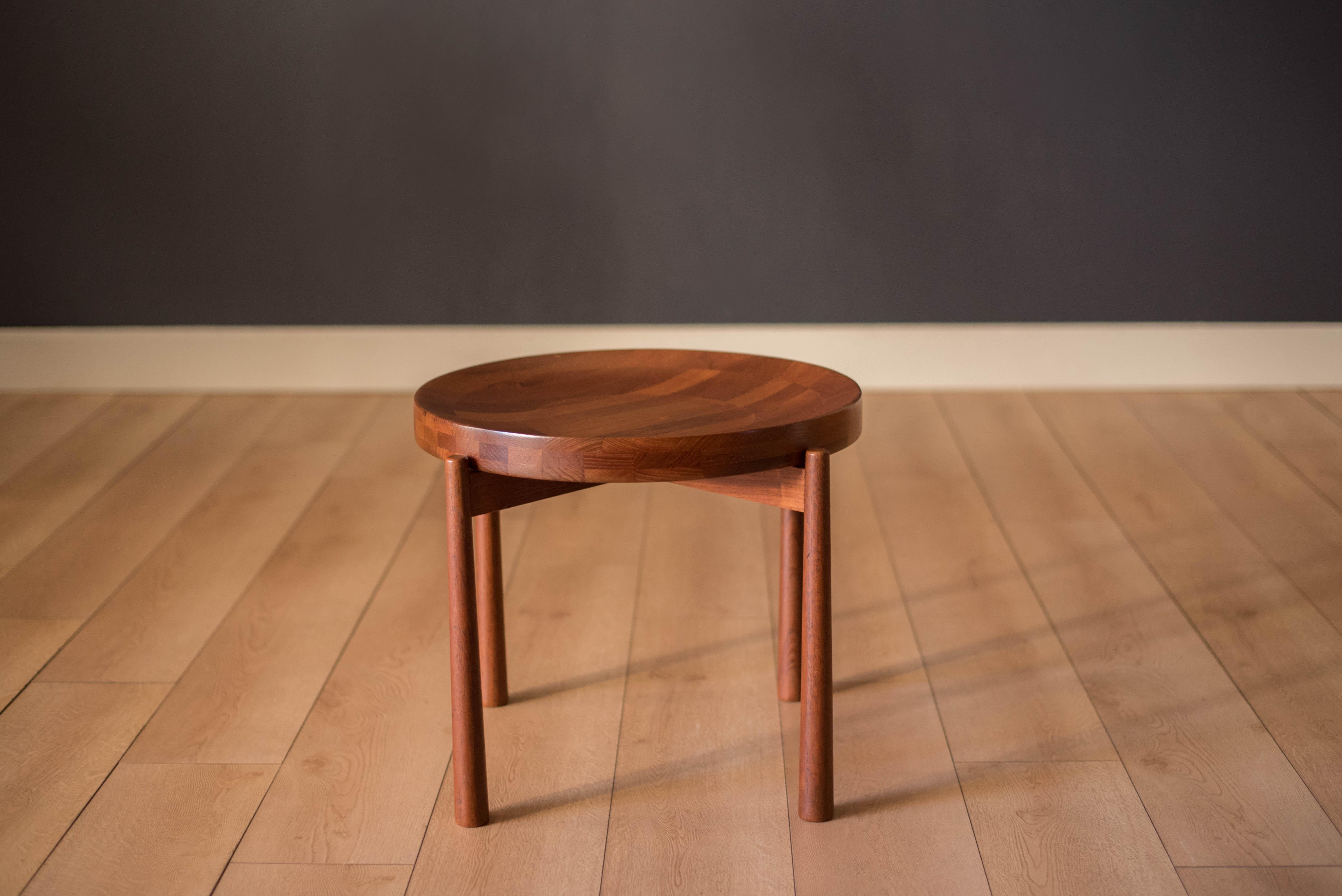 Mid-Century Modern round tray table manufactured by Dux of Sweden. This side table is made of solid planked teak that features a reversible concave and flat top.

Table top 19.5