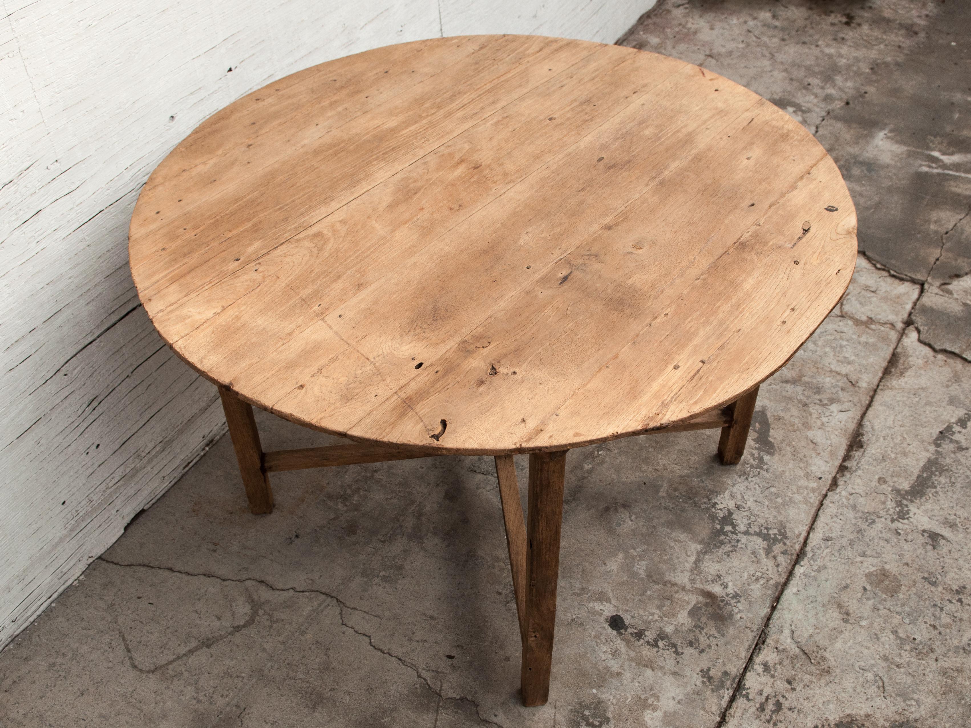 Vintage teak round table / farm table from Burma, mid-20th century.
This rustic teak round table comes from rural Burma.
Dimensions: 46 inch diameter by 29.5 inches tall.