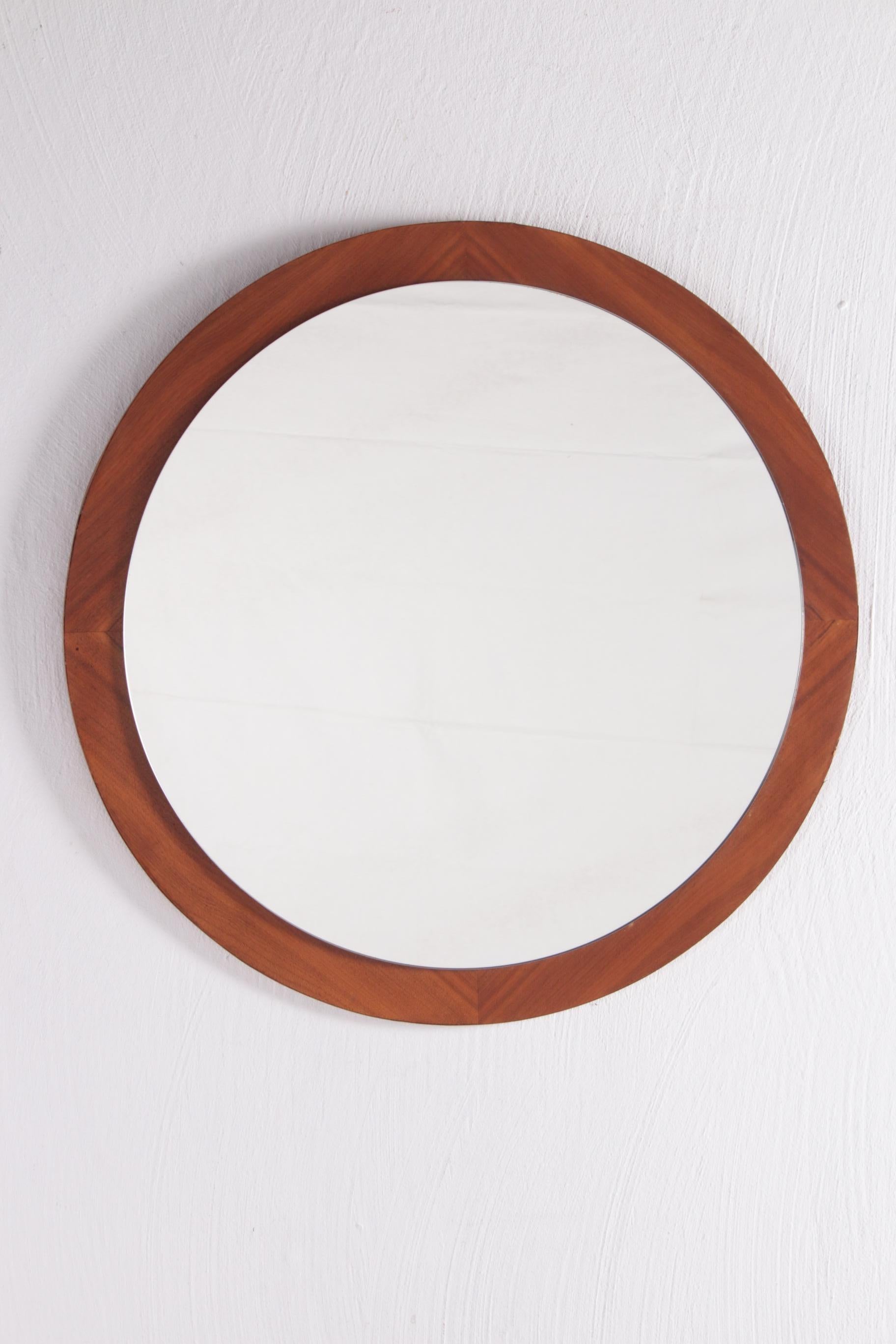 Vintage teak round wall mirror, 1960s


Beautiful teak wooden round mirror made in Denmark around the 1960s.

The mirror is fixed on a round teak surface.

The simple mirror fits perfectly into any interior.