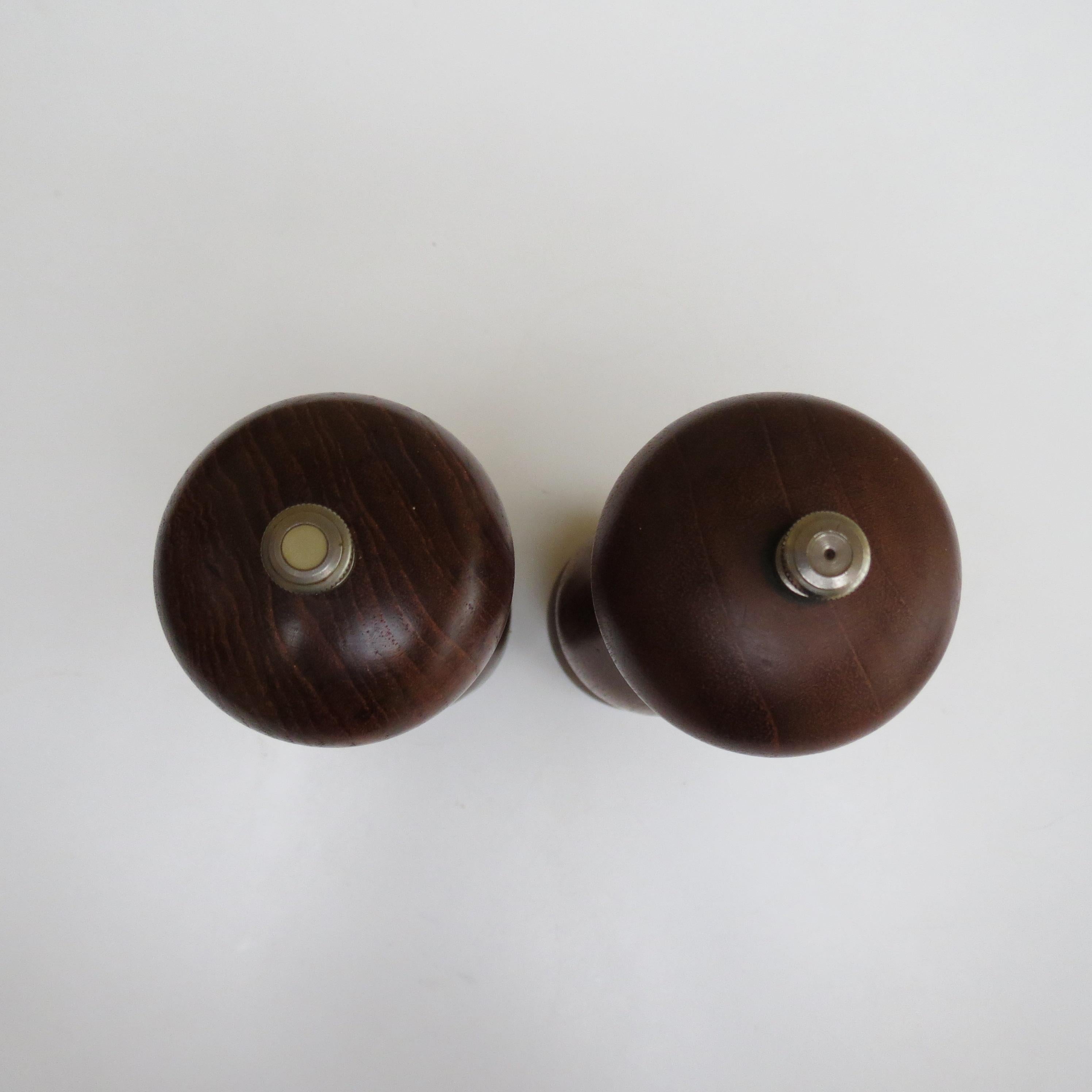 Wonderful pair of grinders by Peter Piper.  Very good quality, made from Teak, with Peter Piper mechanisms to the underside.  Originally designed in the late 1960s, this set is from 1982. Stamped to the mechanisms Super Salt / Pepper Mill Park