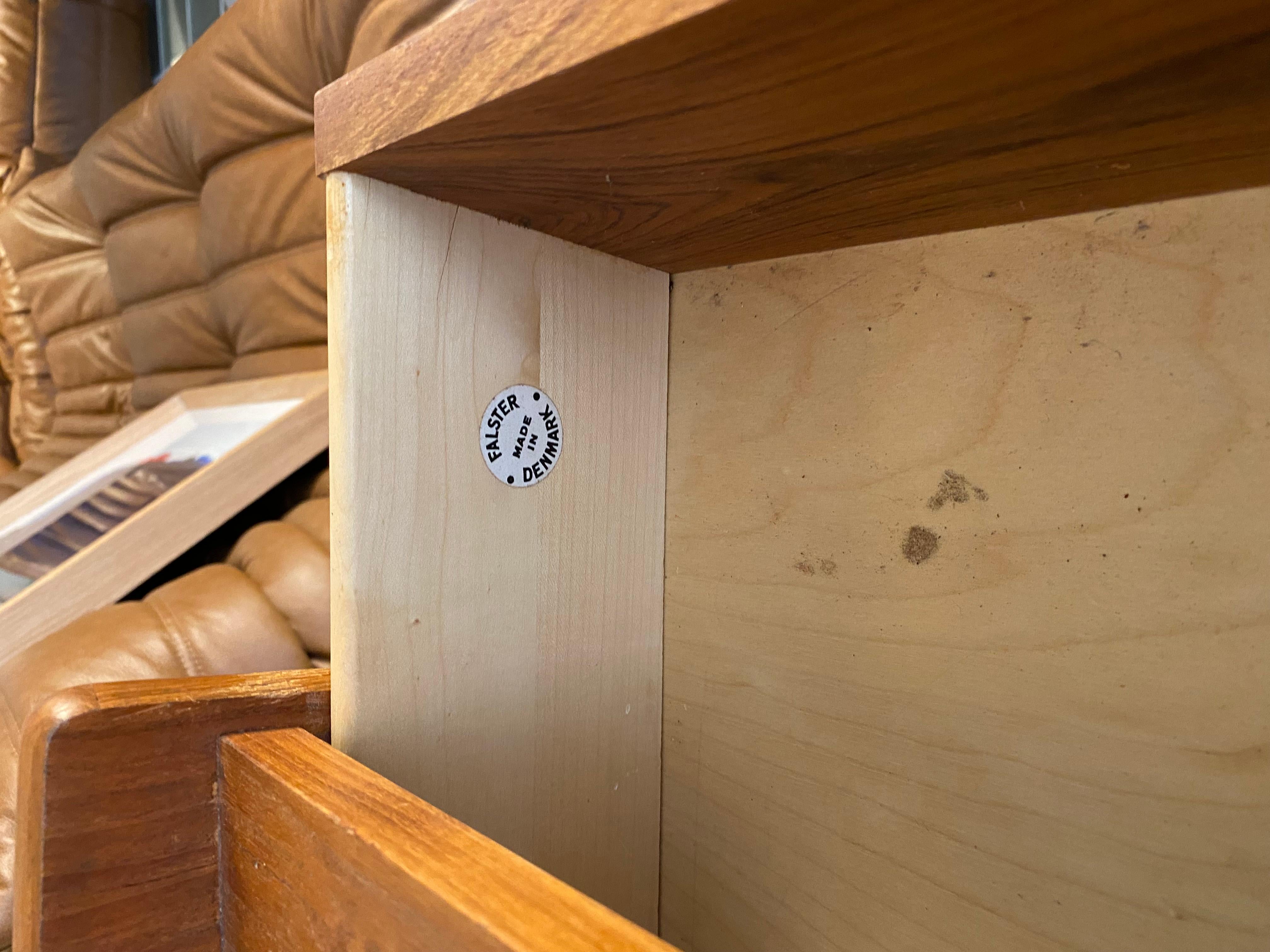 Vintage teak secretaire, produced in Denmark by Falster. It has 3 big draws, 2 small draws, mirror. There is a flap that can be folded. Behind the flap there are two draws and some space for books or other things.