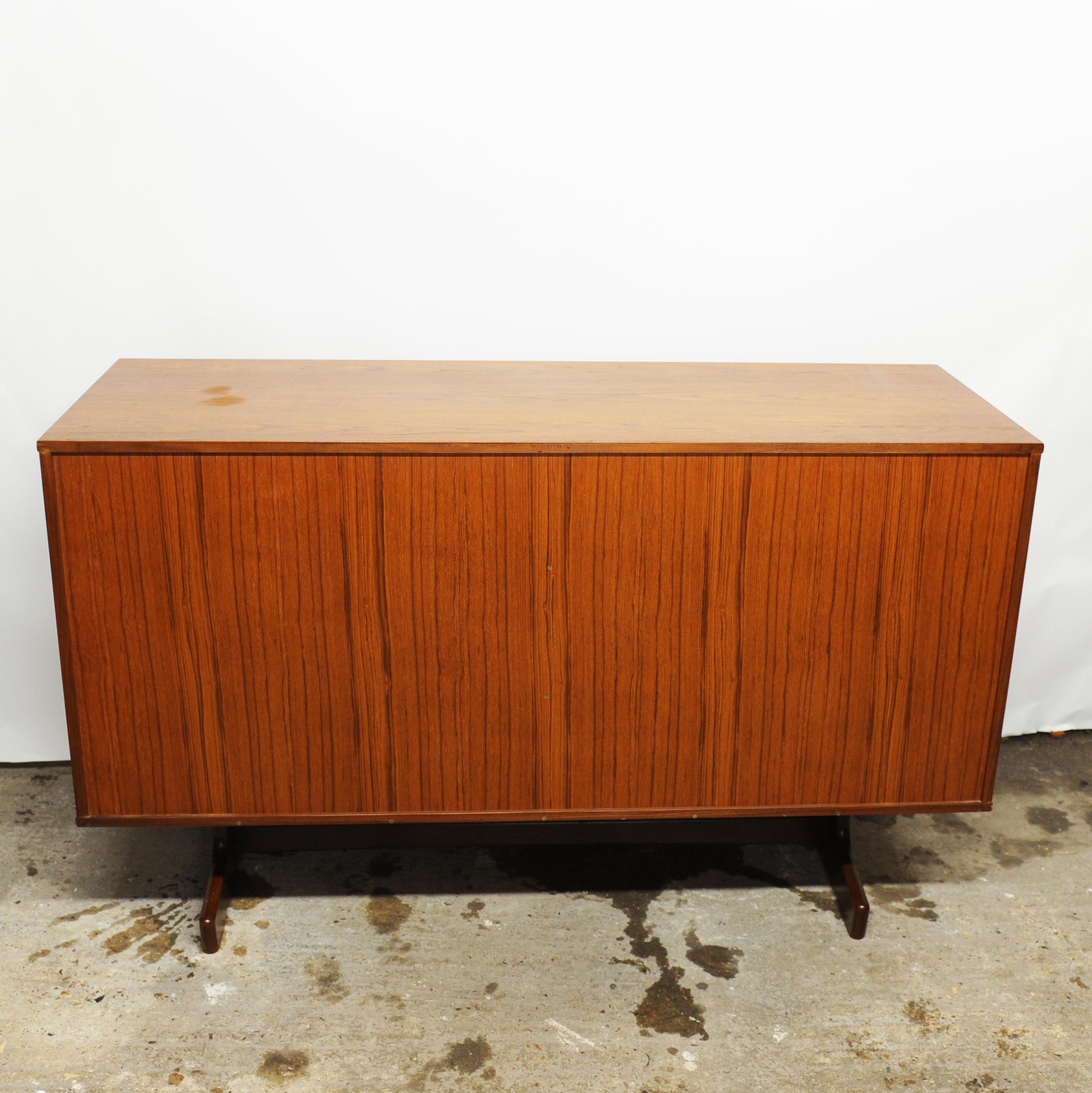 A vintage teak sliding door sideboard with inner shelves.

Manufacturer - Unknown

Design Period - 1970 to 1979

Country of Manufacture - U.K

Style - Mid-Century, Vintage

Detailed Condition - Good with minimal defects

Restoration and Damage