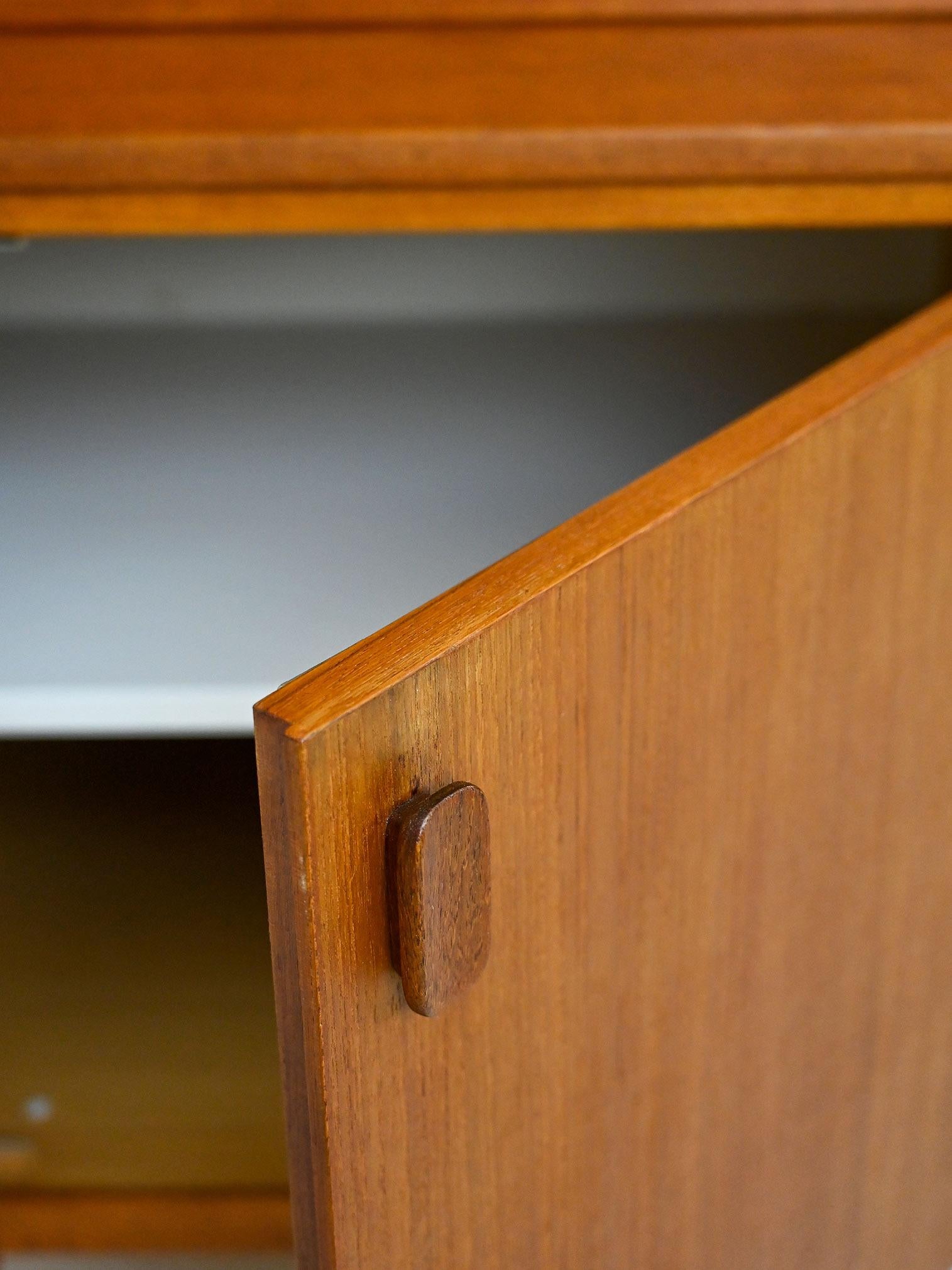 Teak Vintage teak sideboard with hinged doors For Sale