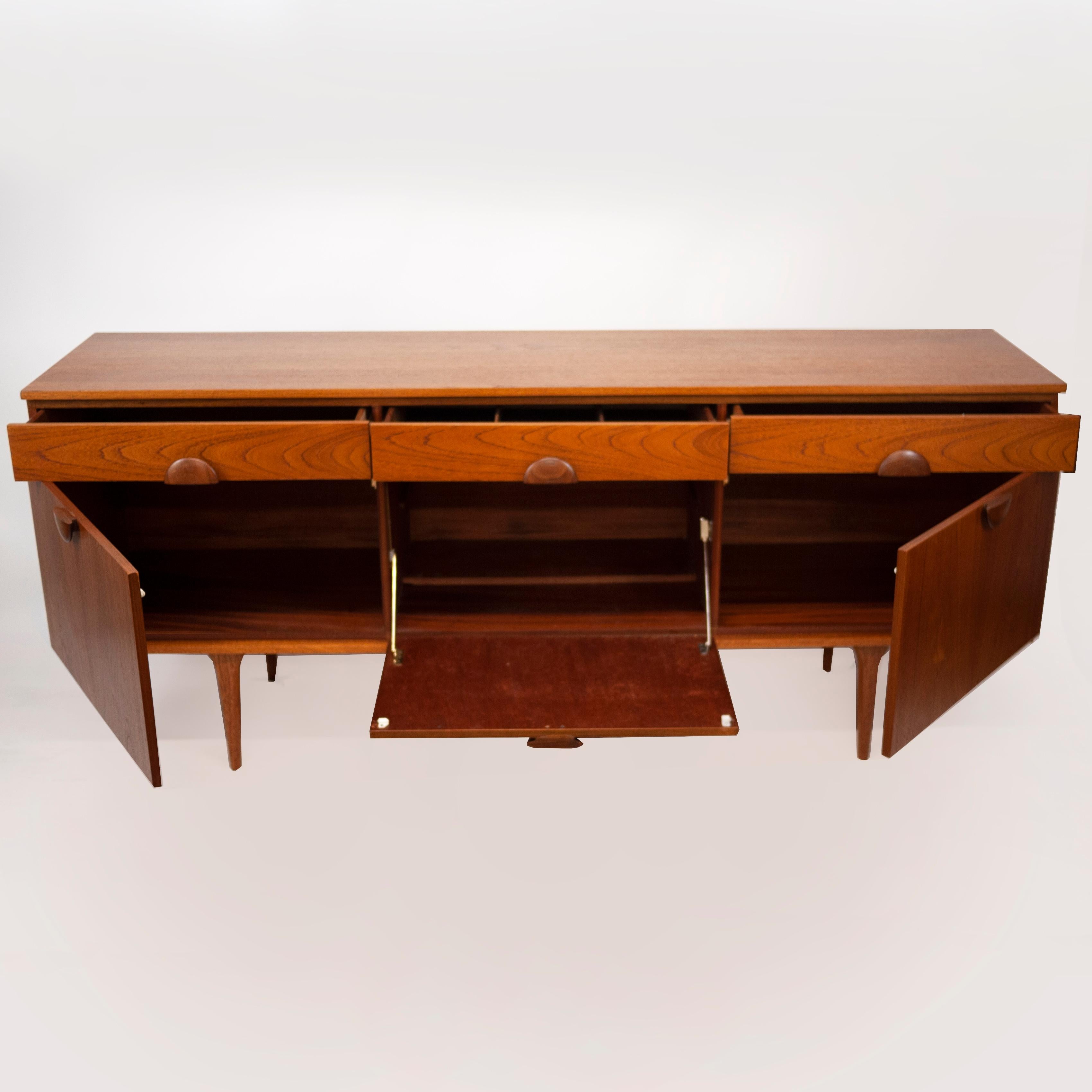 A vintage teak sideboard from the 1960s. The sideboard features 3 top drawers and 3 lower cupboards.

Manufacturer - Unknown

Design Period - 1960 to 1969

Country of Manufacture - U.K

Style - Mid-Century

Detailed Condition - Good with