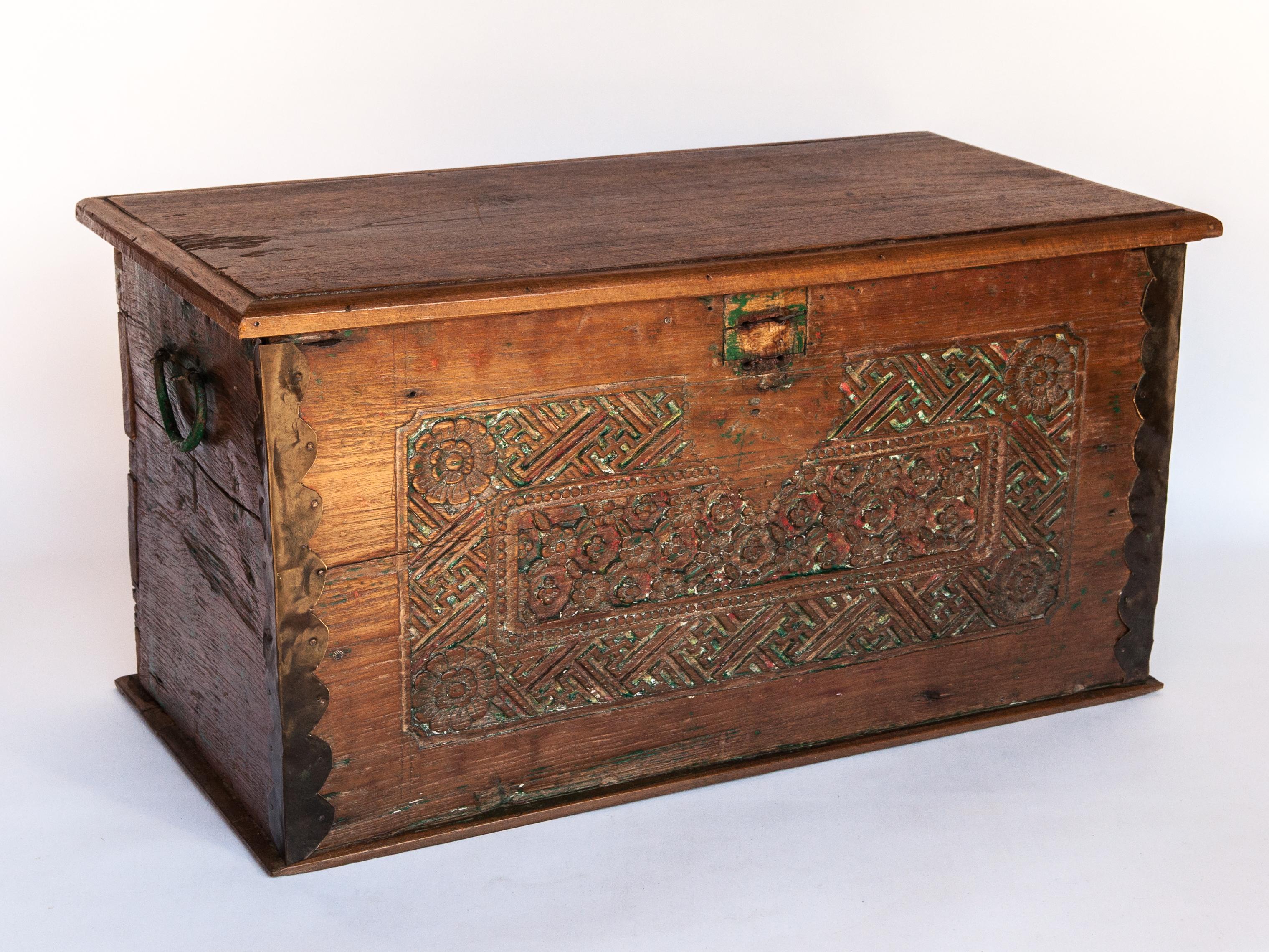 Vintage teak storage chest with carved design from Java, mid-20th century.
This old teak wood chest comes from central Java, where it would have been used to store textiles and other valuables in a rural Javanese home. The front panel is carved in