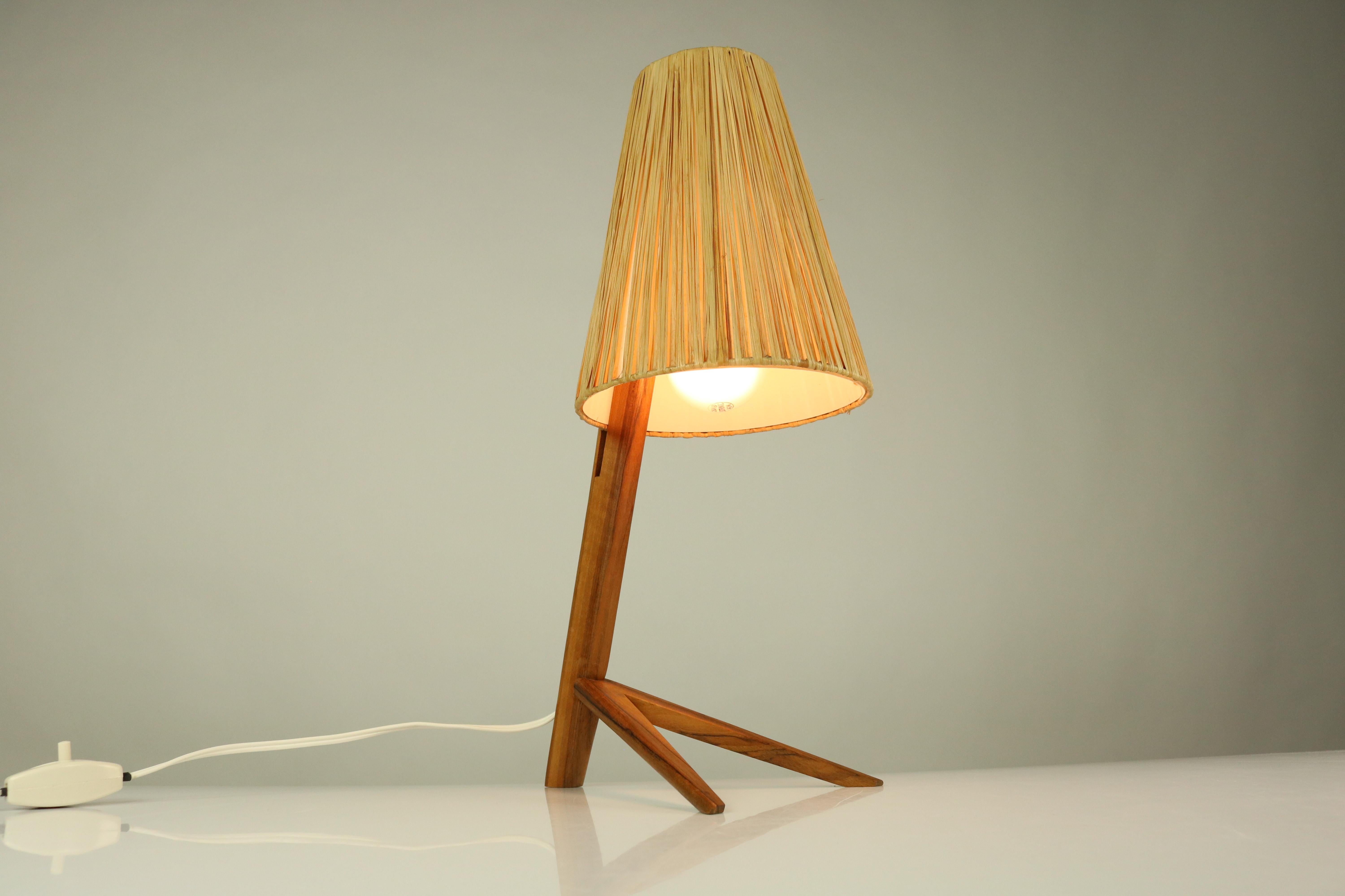 Vintage 1950s table lamp made of a wooden frame and a best lampshade
in Dornstab design attributed to J.T. Kalmar Austria
socket: E27 - medium Edison screw
weight 380 gr / 0.8 lbs.


 