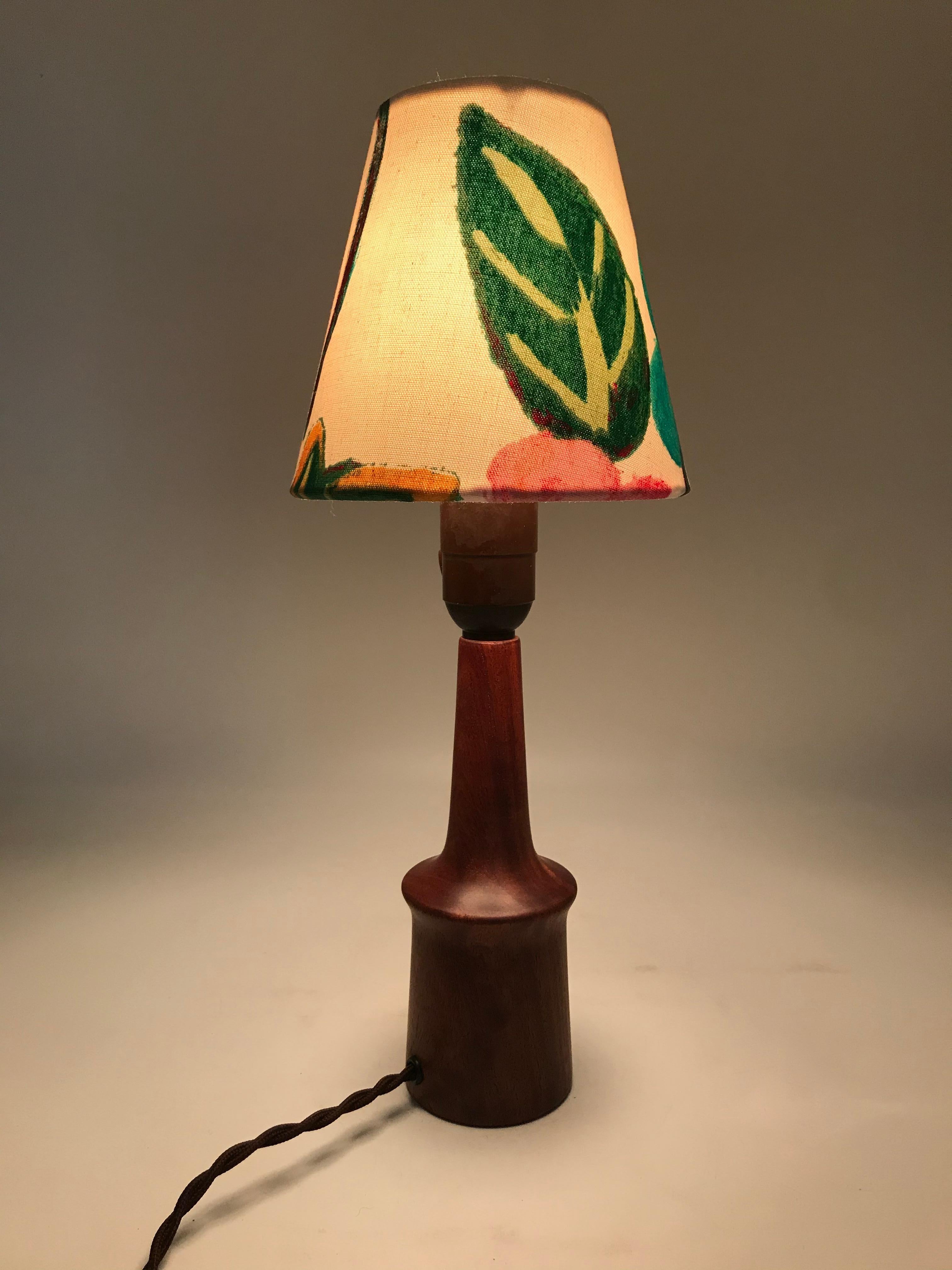 Vintage mid century table lamp. 
Solid teak with no cracks.
Rewired and can be fitted with an EU or US plug.
Shade not included. 