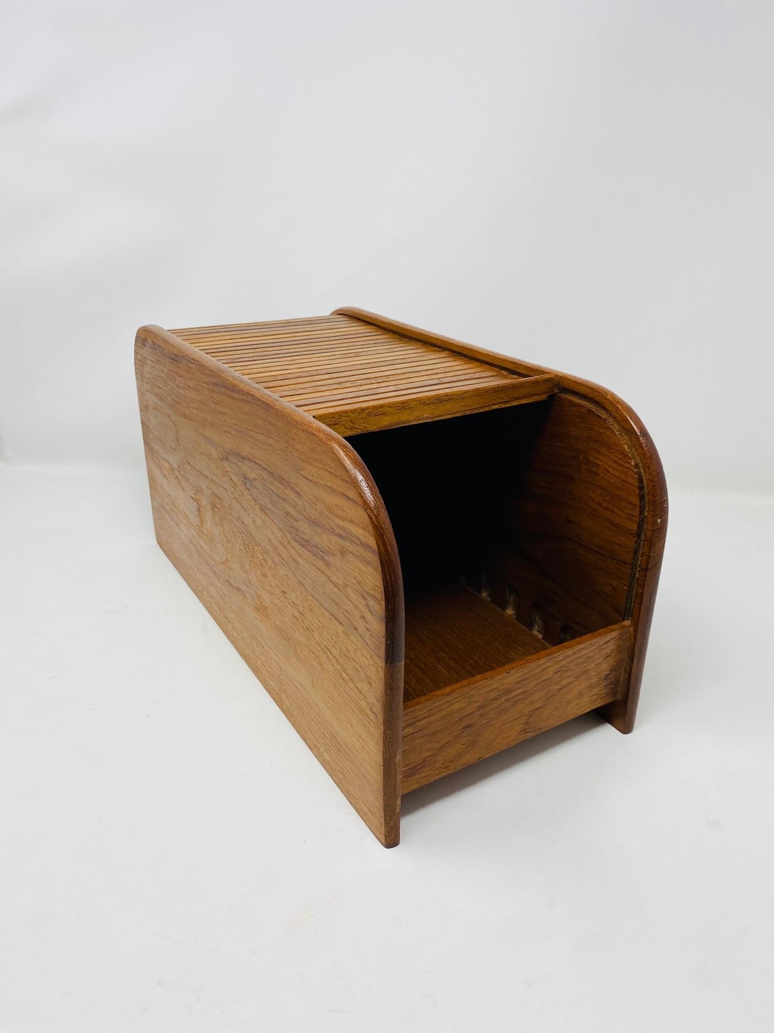 Beautiful storage and organizing box. This vintage piece is similar to Kalmar inc.  This box expresses beauty and form in a precious material. This piece can be used as storage for a variety of purposes. The teak wood adds beauty, form and function.