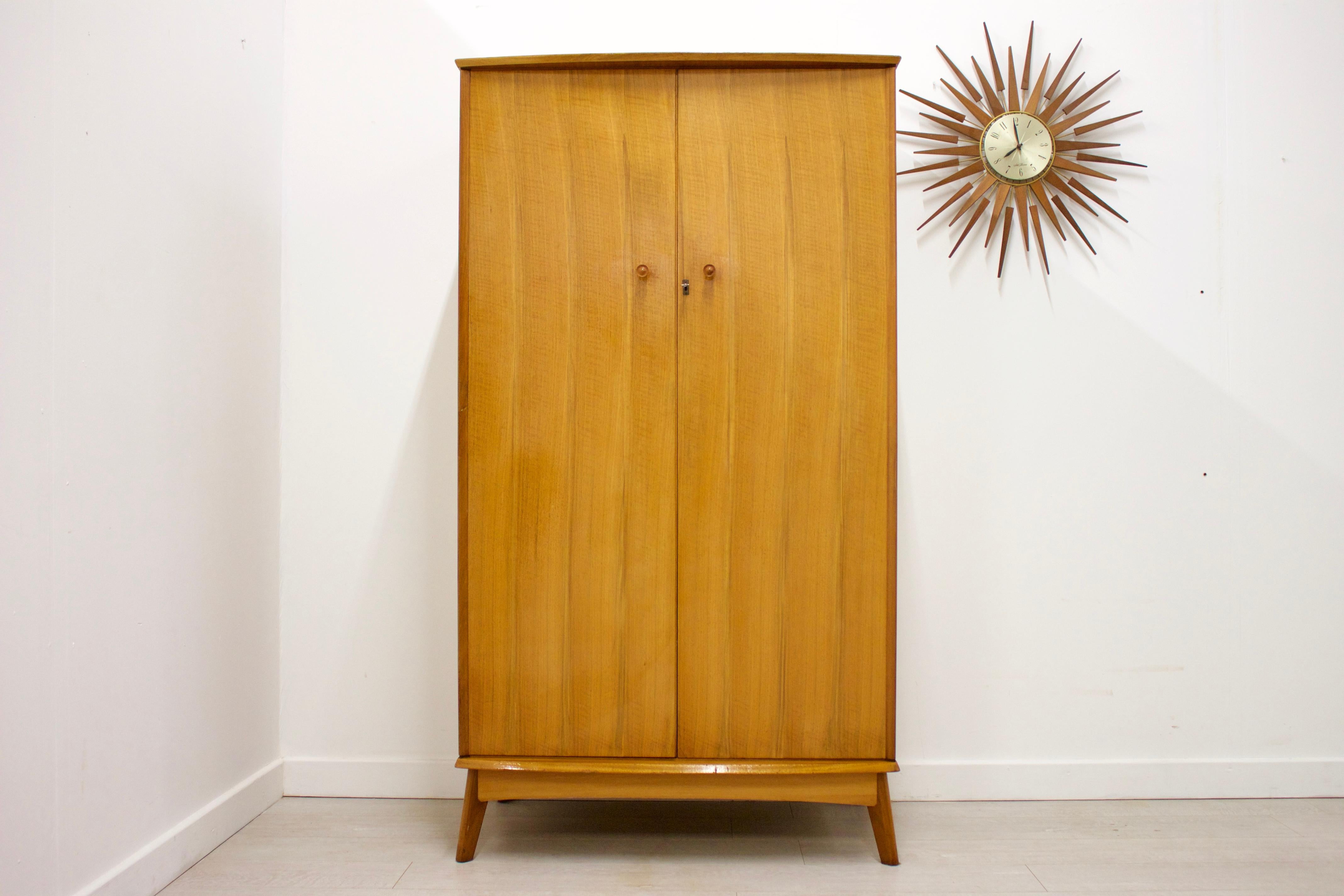 - Mid-Century Modern wardrobe
- Manufactured by Alfred COX
- Made from walnut and walnut veneer.