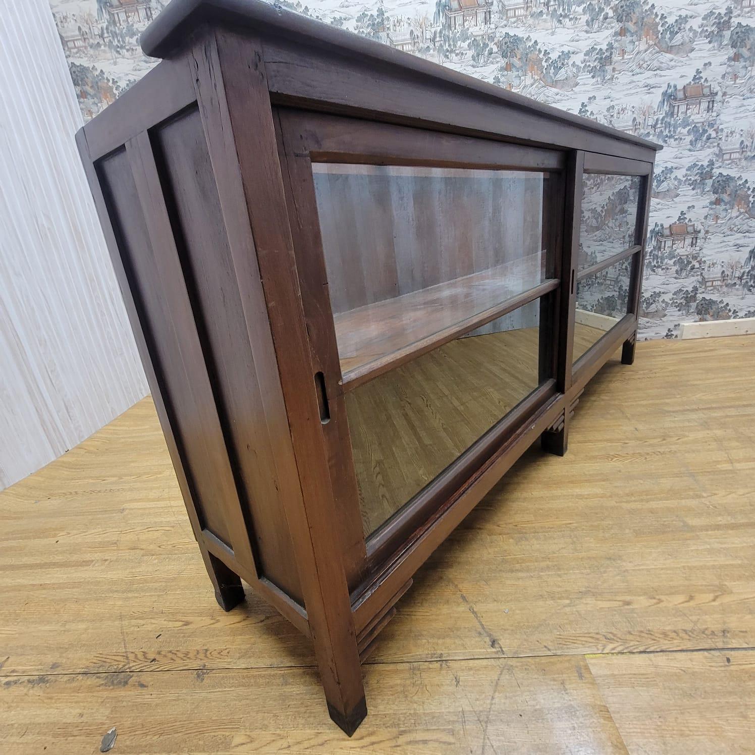 Late 20th Century Vintage Teakwood Low Bookcase / Display Cabinet with Sliding Glass Doors For Sale