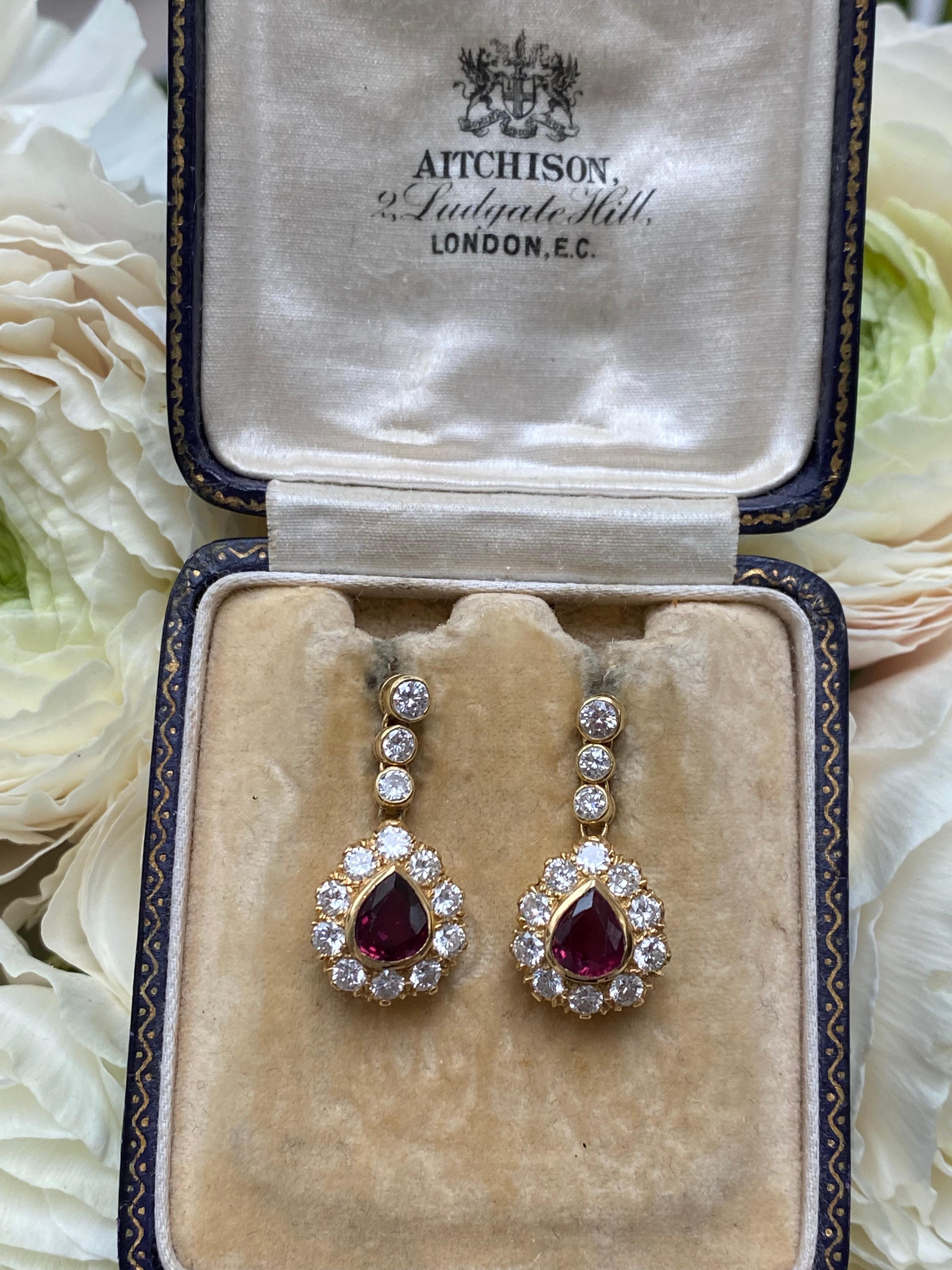 Vintage Teardrop Ruby and Diamond Earrings. Certified 1.7cts of rubies and 1.5cts of brilliant cut diamonds (G/H SI) All set in 18ct gold, they measure 25x12mm.