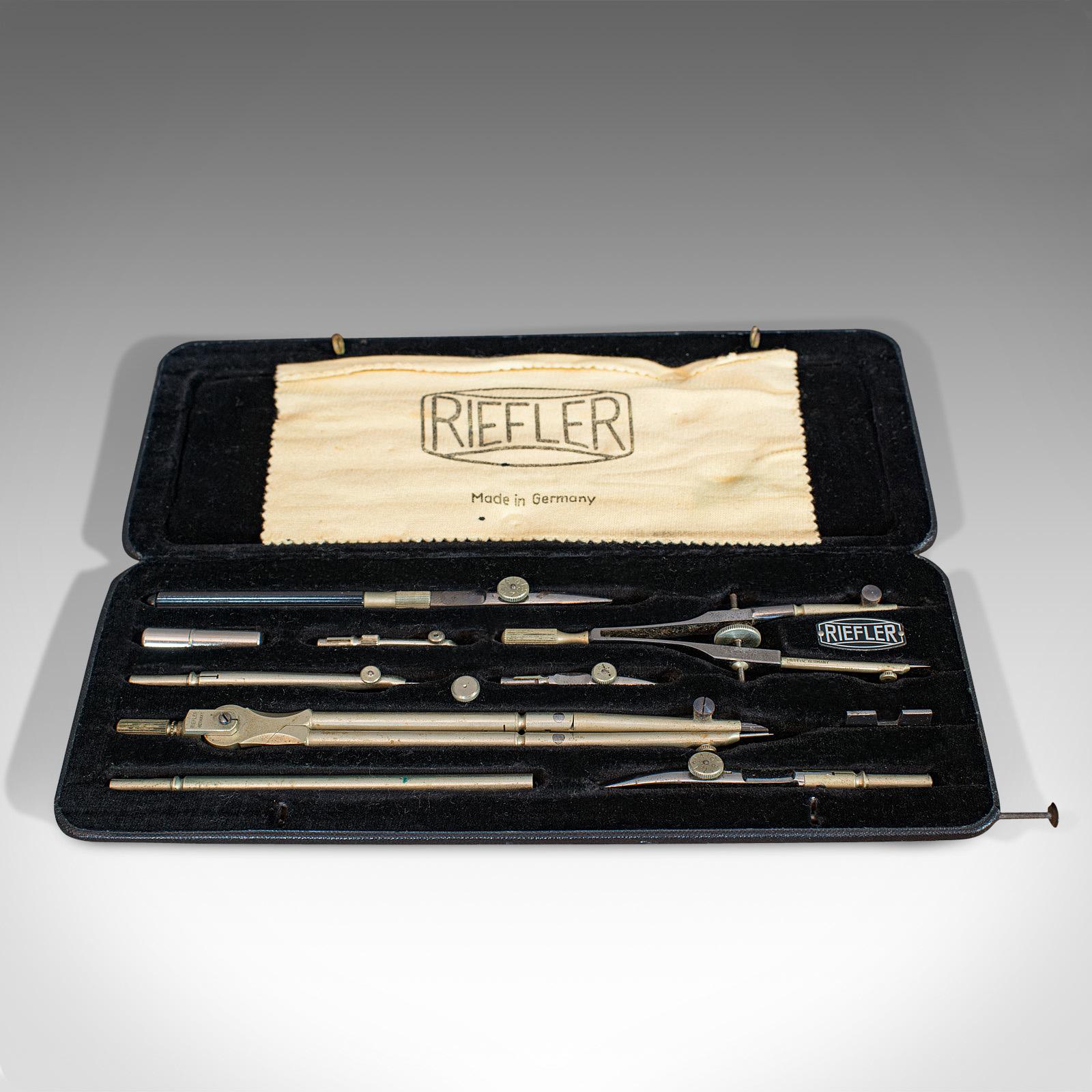This is a vintage technical drawing case. A German, silver nickel surveyor's set by Riefler of Munich, dating to the mid-20th century, circa 1950.

Quality, vintage set by a renowned maker
Displaying a desirable aged patina
Silver nickel