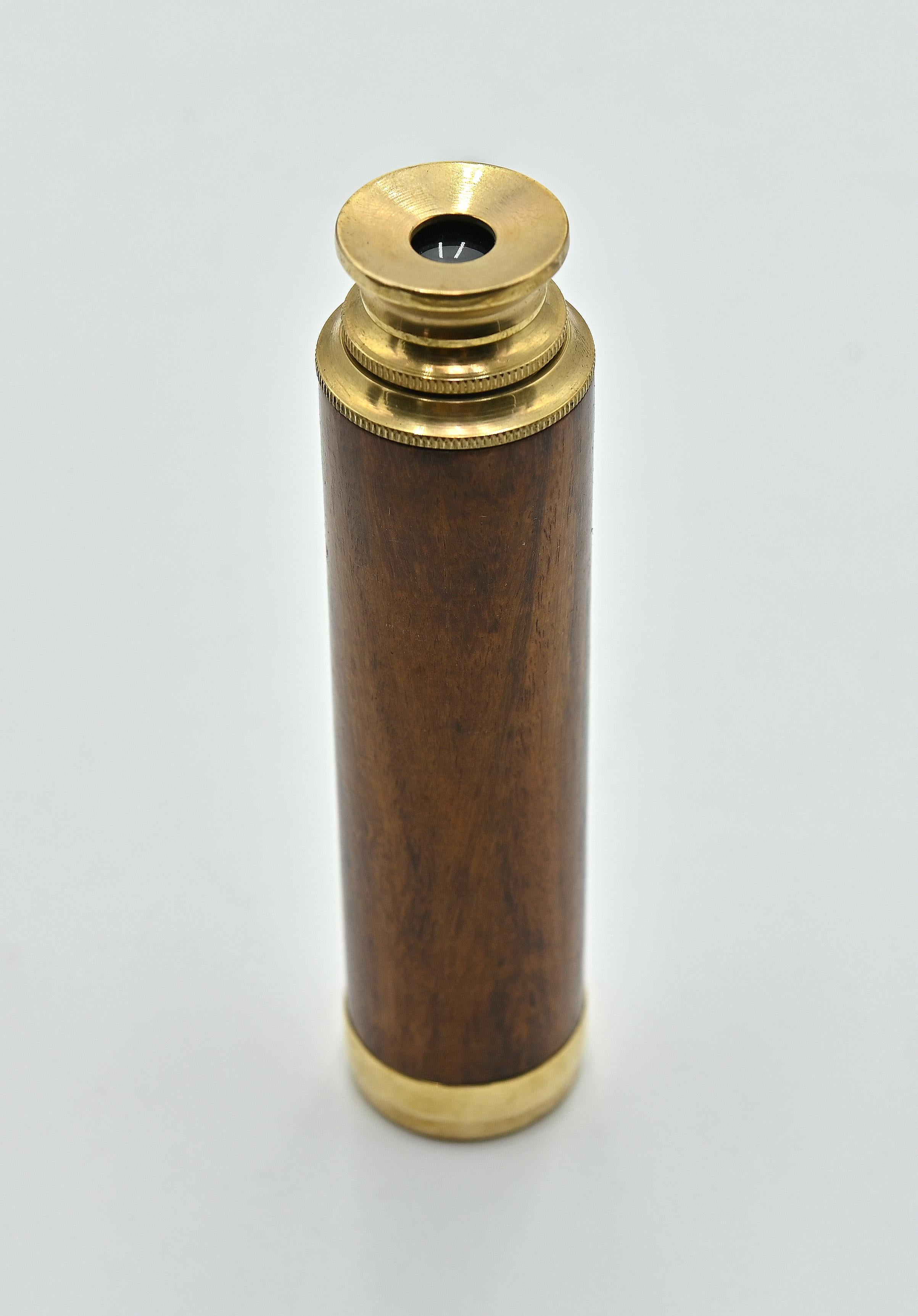 Vintage Telescope is a scientific object realized in the early 20th Century.

A bronze telescope with glass lenses and wooden grip, close up.

Don't miss this vintage object!