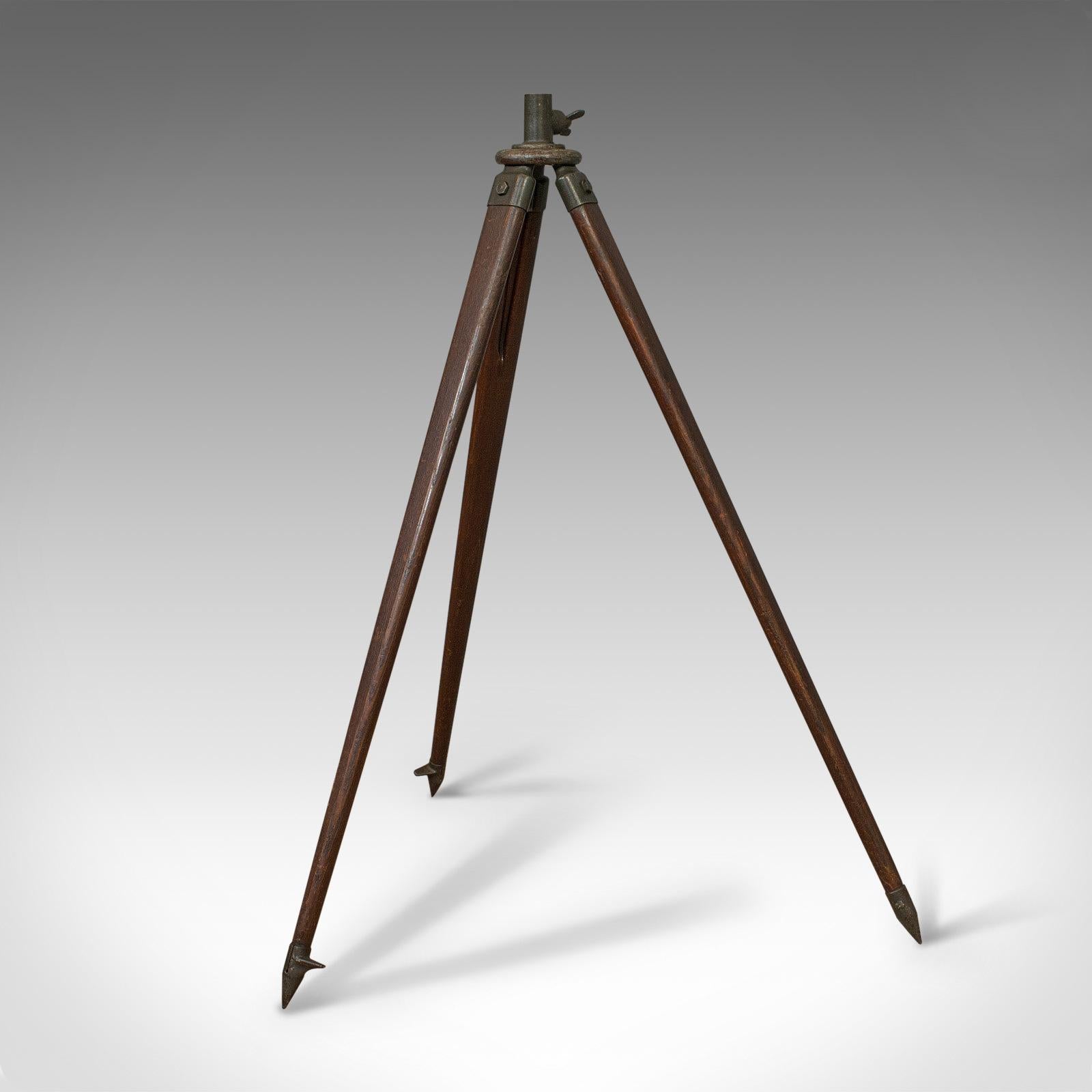 antique telescope with tripod