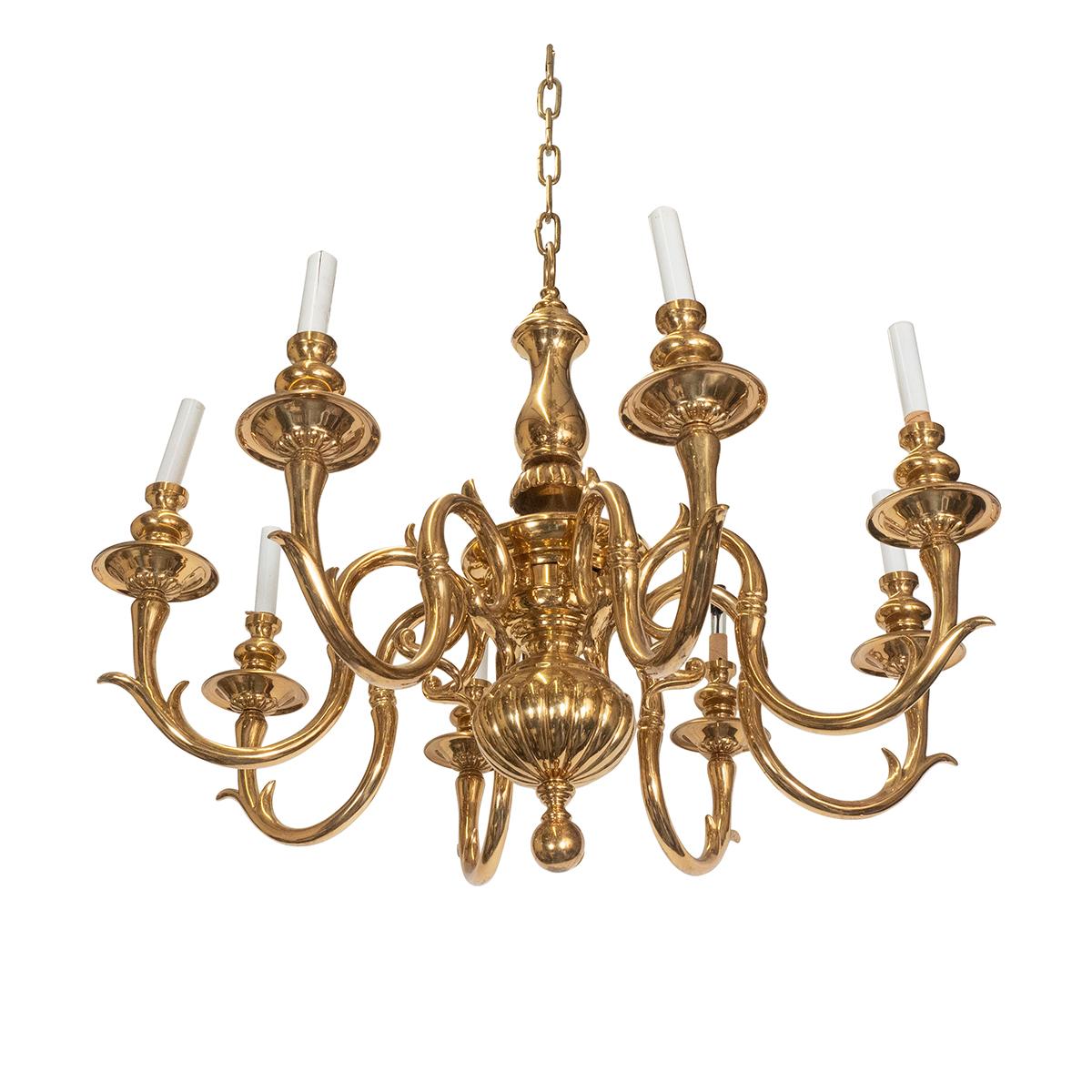 Cast brass curvilinear chandelier with tendril motif arms.
