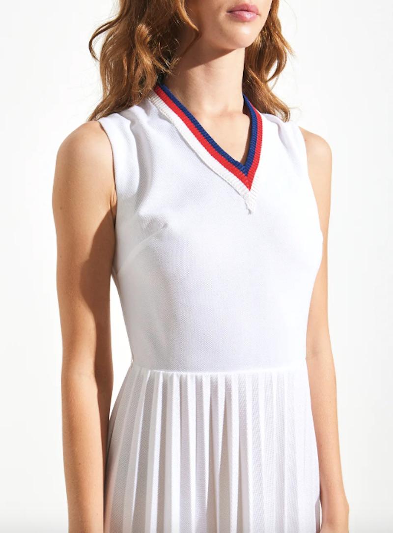 Vintage Leroy pleated tennis dress with red and blue lined v-neck. 

Marked by Leroy
100% Polyester
Bust 34 in
Waist 24 in
Length 52 in

Marked size 10

Excellent Vintage Condition. Measurements are taken flat. Model is 5ft 9.5 in 
